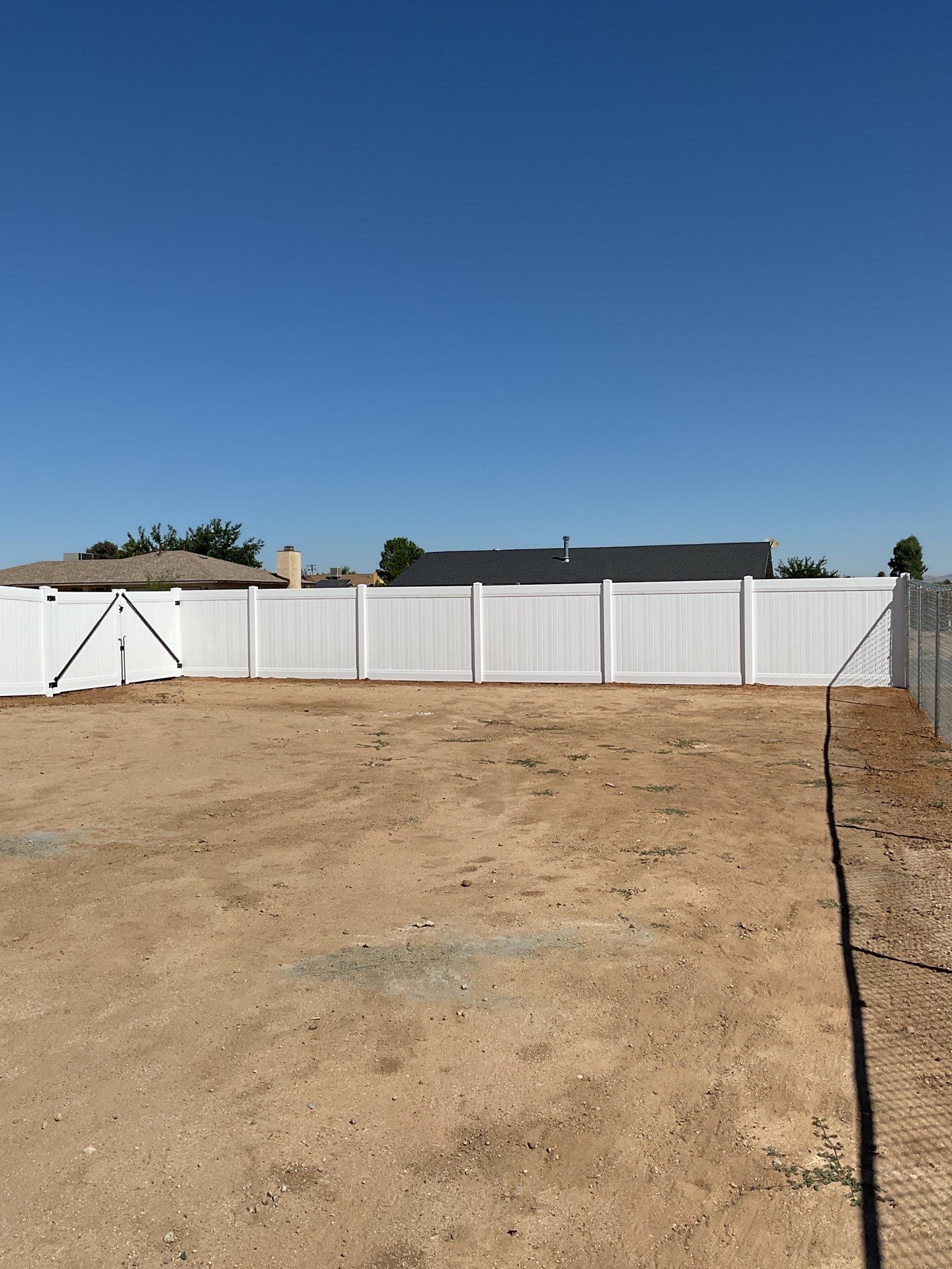 6ft White Privacy Vinyl Fence with Chain-link Fence by Fence Guys Inc.