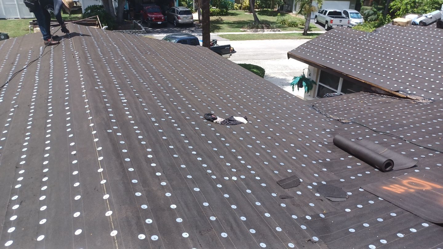 Residential Roofing Installation using 1" Nail strip metal roof by BLUES BROTHERS ROOFING