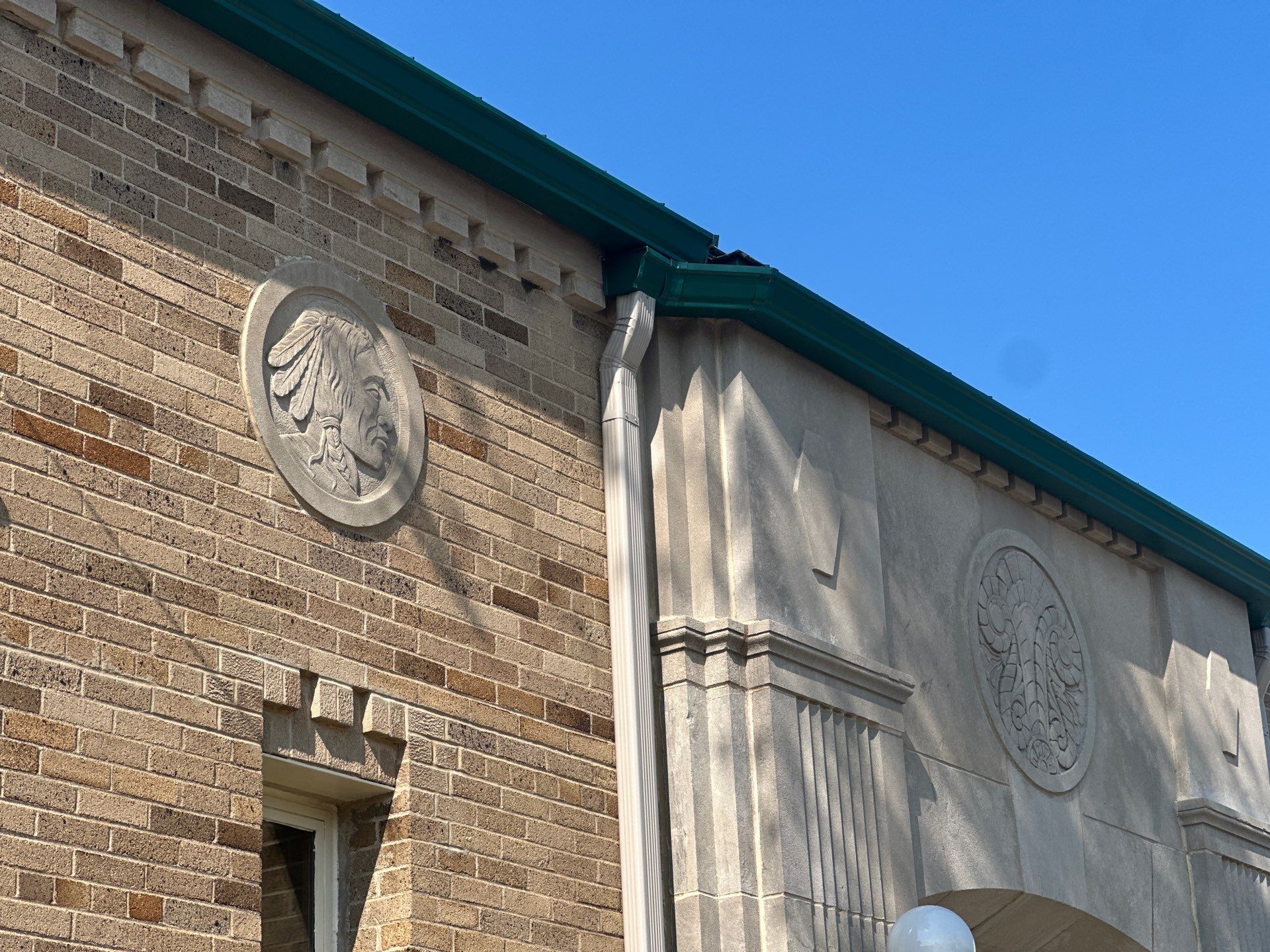 Gutter and Gutter Screen Installation for Traverse City Masonry Building by Rainbow Seamless Systems
