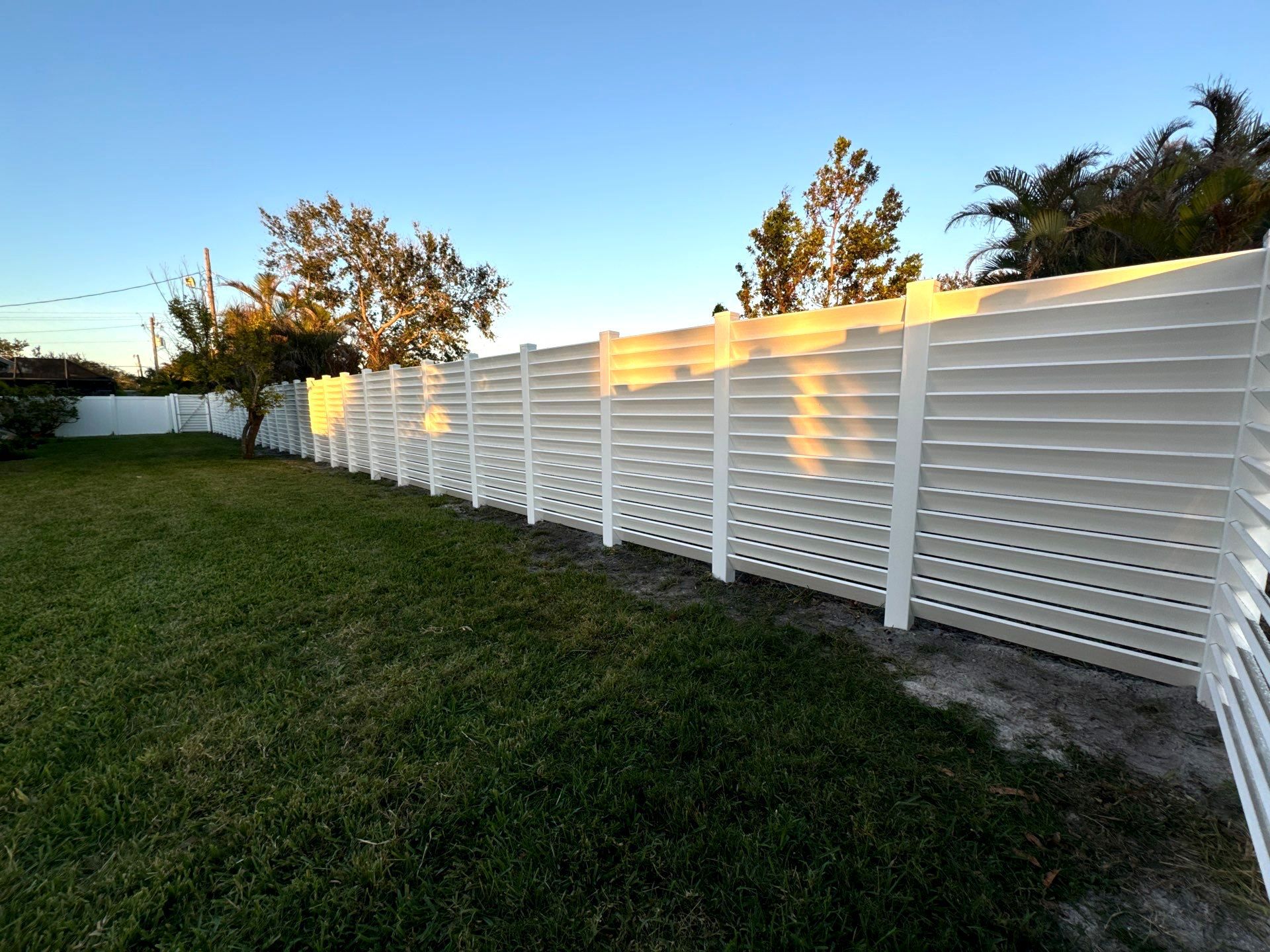 Vinyl Fence Installation using 6Ft Professional Grade White Vinyl Louvered Privacy Fence by Asap fence and gates, LLC