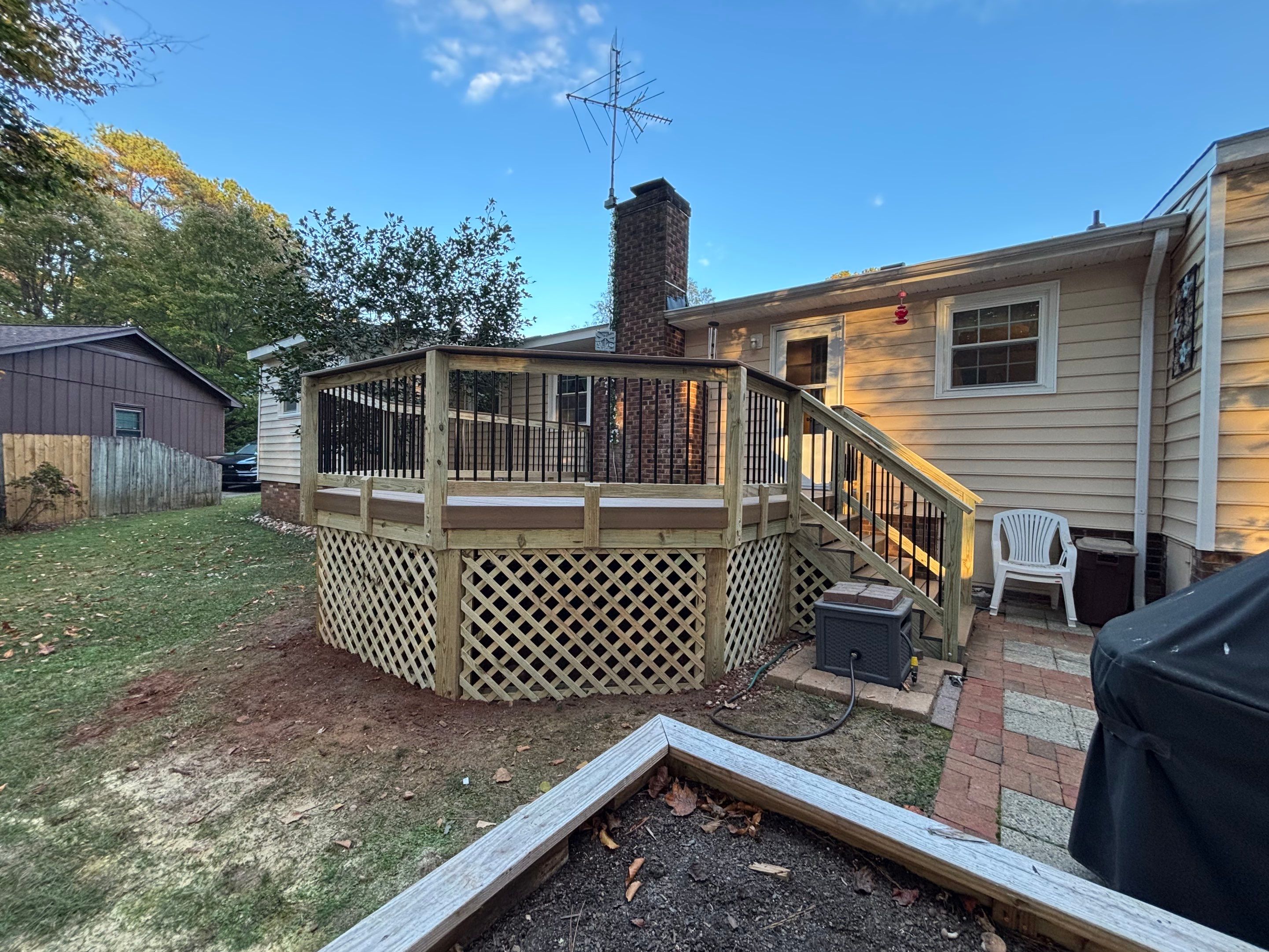 Composite Deck Resurfacing with Metal Balusters in Cary by The Remodeling Company