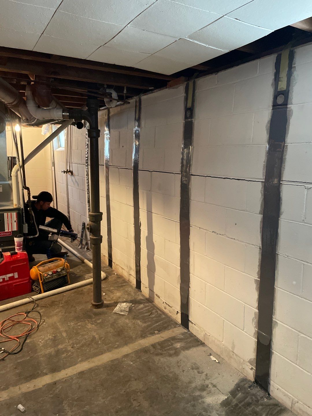 Bowing wall repair with Fortress Invisibeams by ACE Waterproofing & Basement Solutions