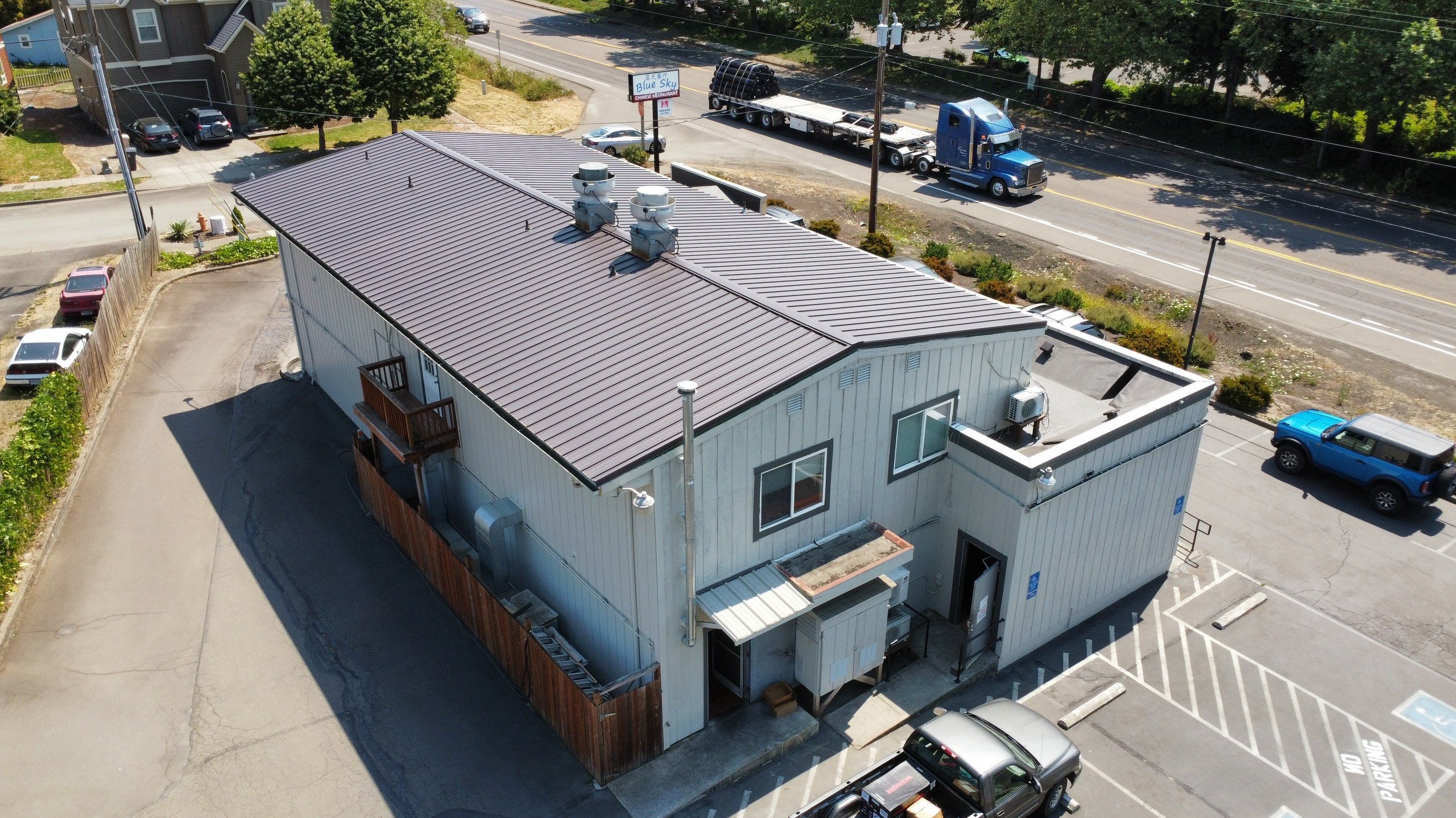 Commercial Flat Roof Installation using Bruce and Dana Snap Lock Metal (Color: Brown) by Orezona Building & Roofing Company, Inc.