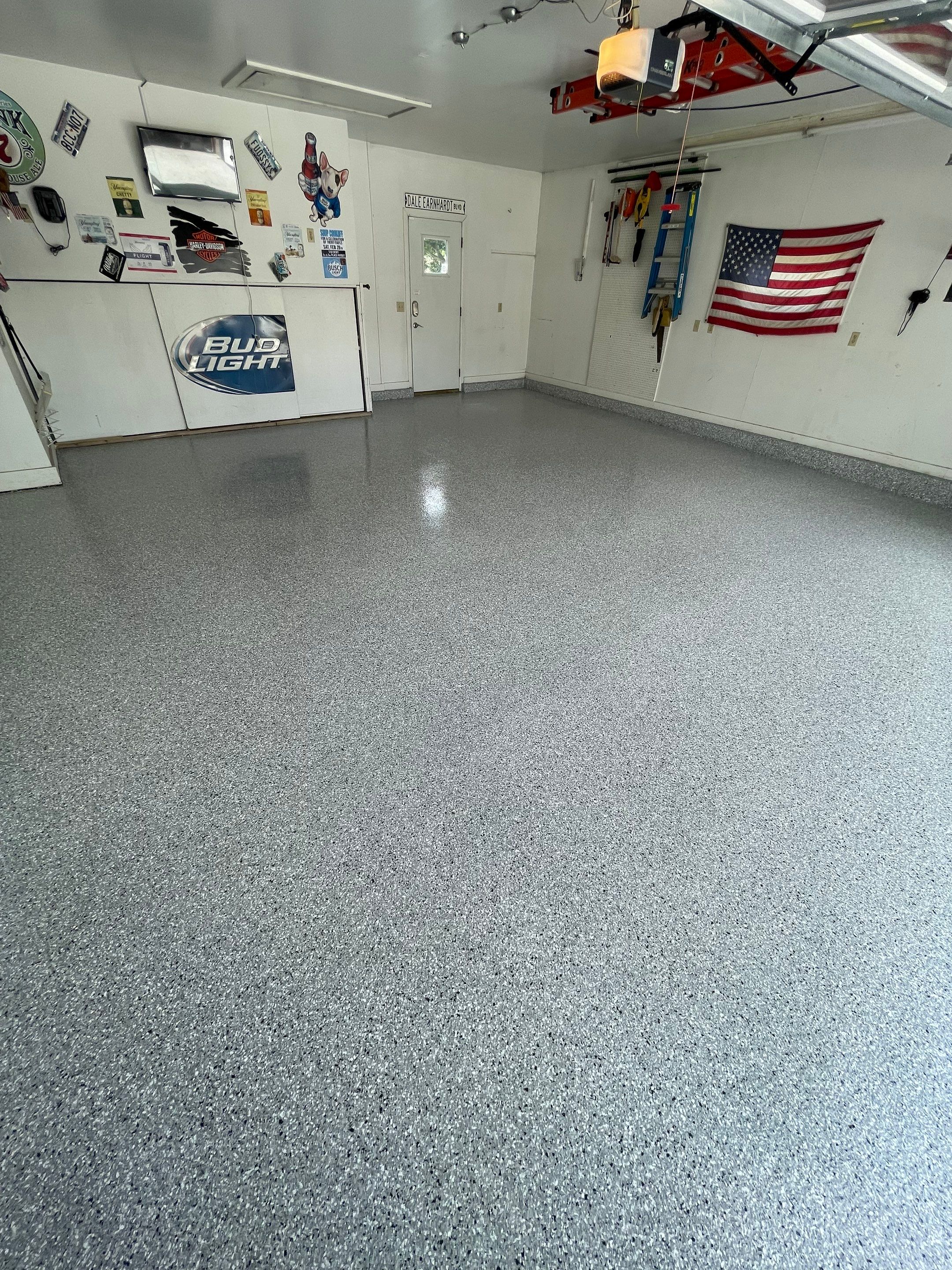 Residential Garage Floor Coating with Feather Grey Finish in Sioux Falls by Select Painting, Coatings & Garage Cabinets