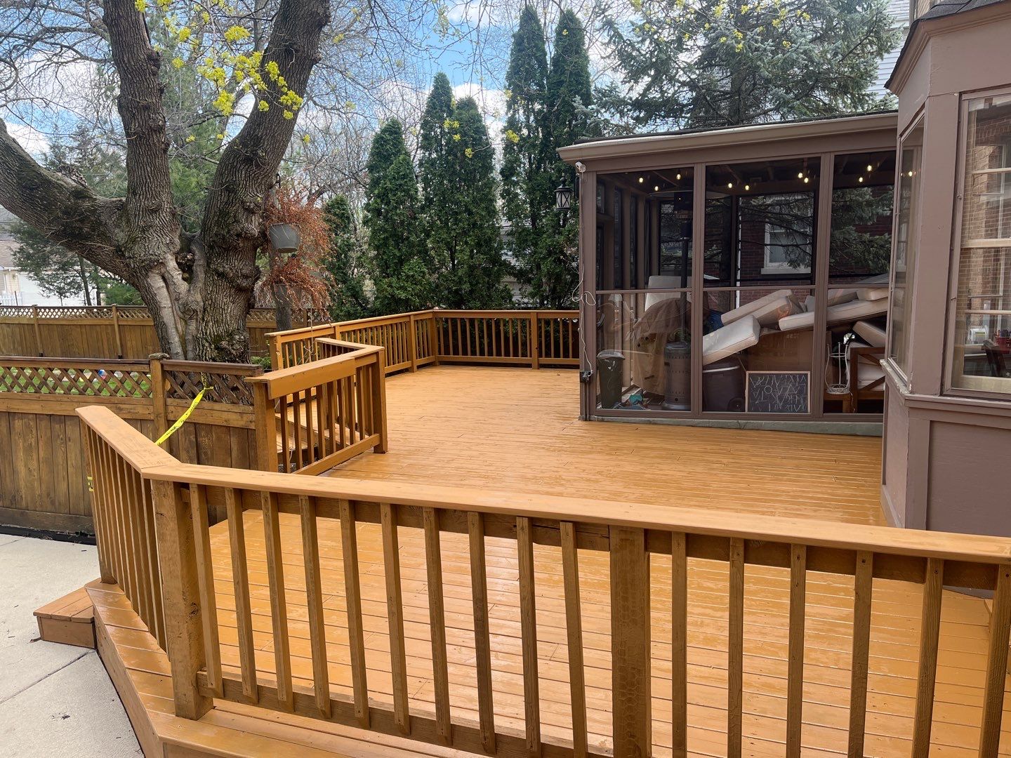 Wood cleaning and staining using Armstrong cloark oil stain by Northern Power Washing LLC.