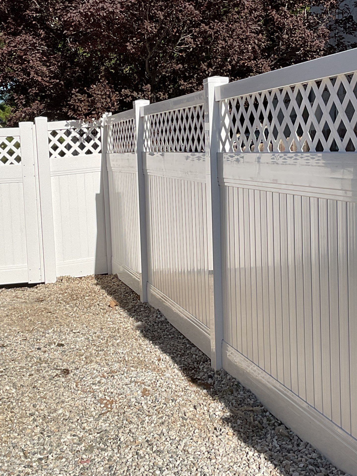 Lattice Vinyl with Privacy Vinyl Fence by Fence Guys Inc.