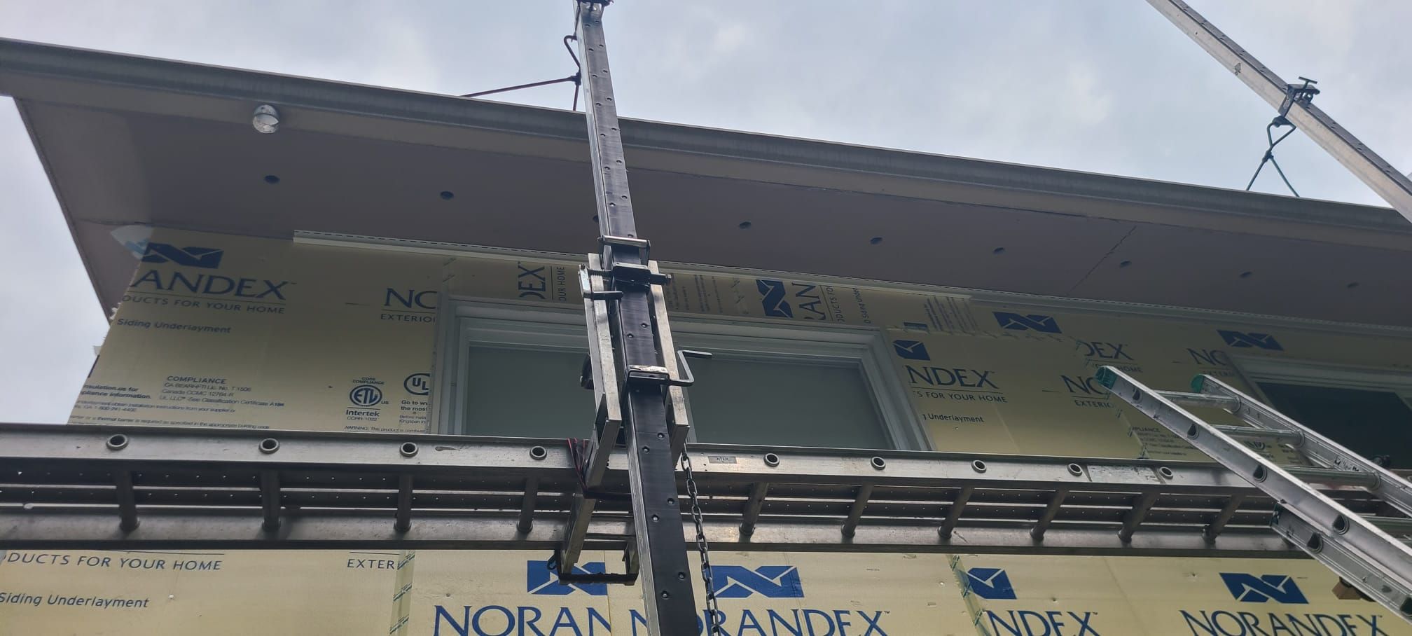 Fairfax: Residential Siding Replacement with CertainTeed 8" Board and Batten Siding in Desert Tan by RM Banning, Inc.