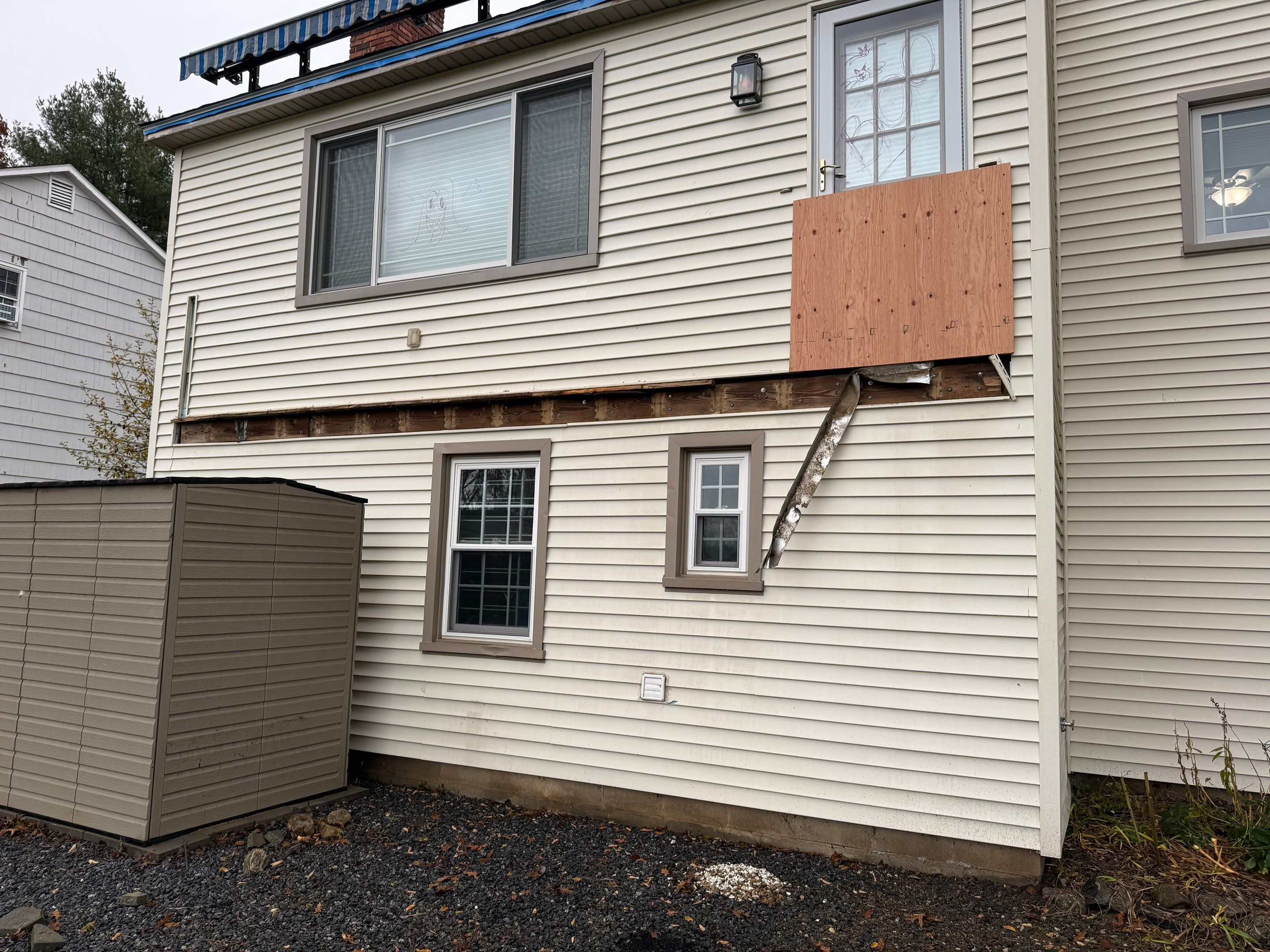 Replacement deck with Trex linage Biscayne boards and White Transcend railing with cocktail rail, and Trex gate. by DiGiorgi Roofing and Siding Inc