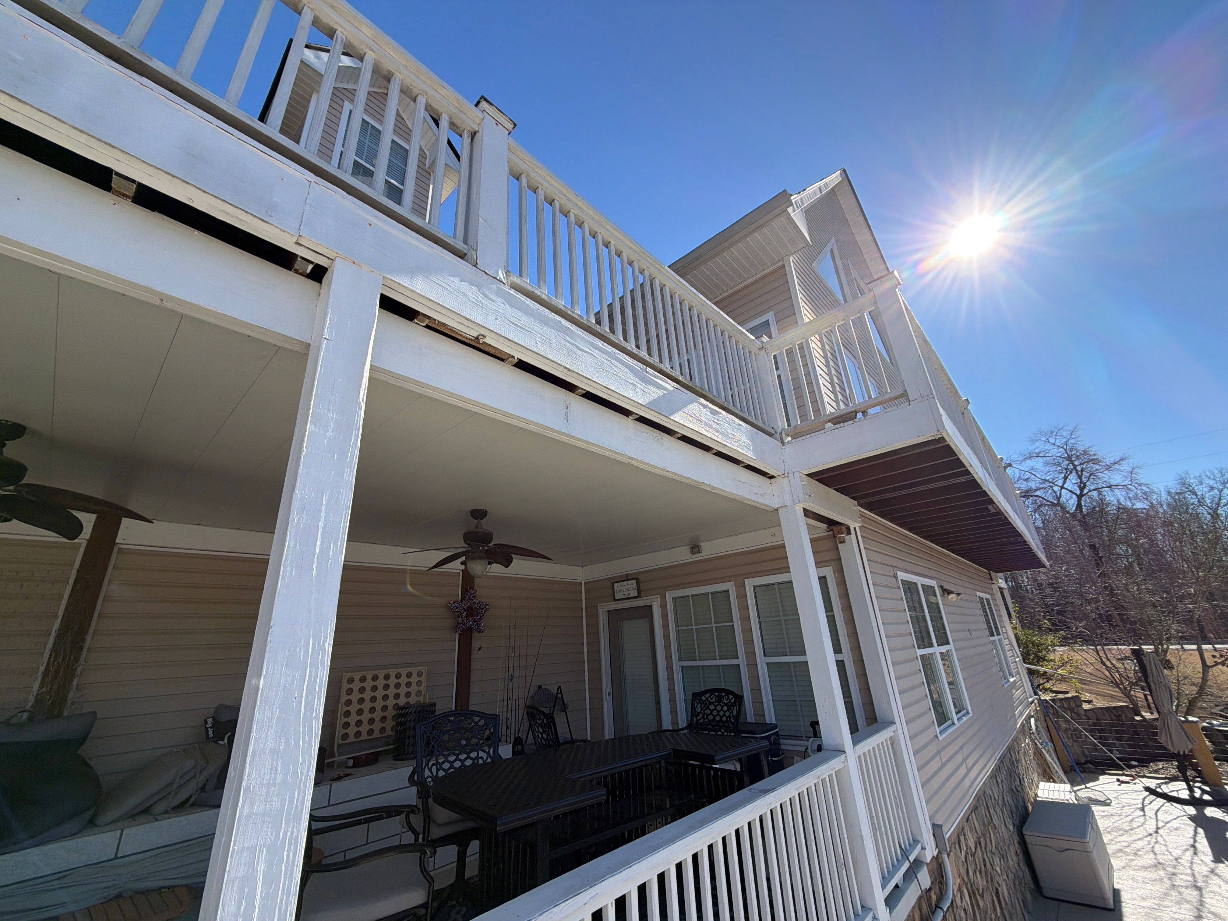 Cumming, GA Lake House Deck Resurface and Extension using Pressure Treated Pine and Skyline Cable Railing by Nelson Exteriors 