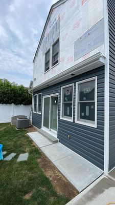 Gutter Installation using 5"white K style seamless gutters and 2x3 white leaders