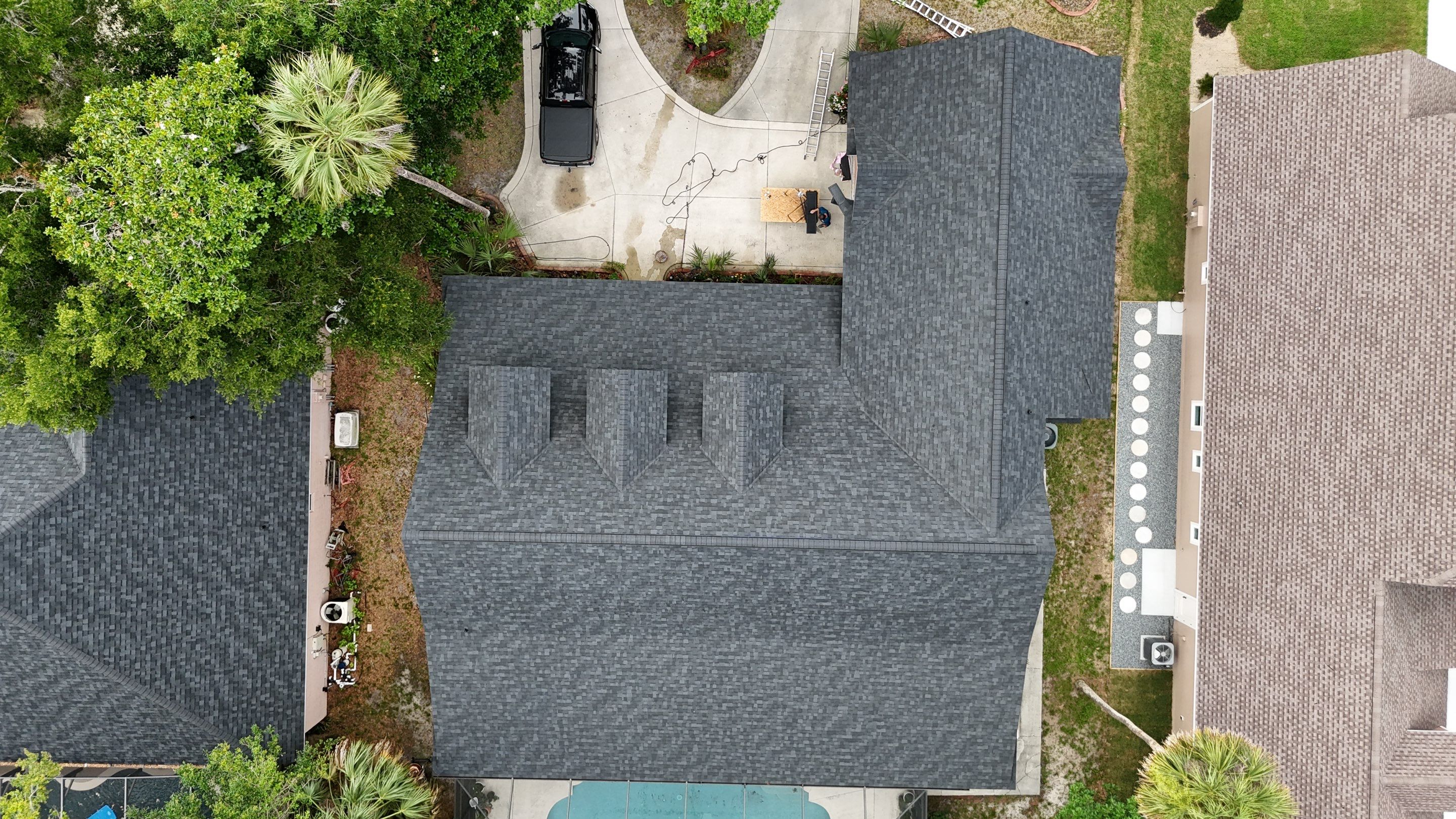 Comprehensive Onyx Black Asphalt Shingle Roof Replacement for Flagler Beach Residence by Trinity Restoration and Roofing LLC