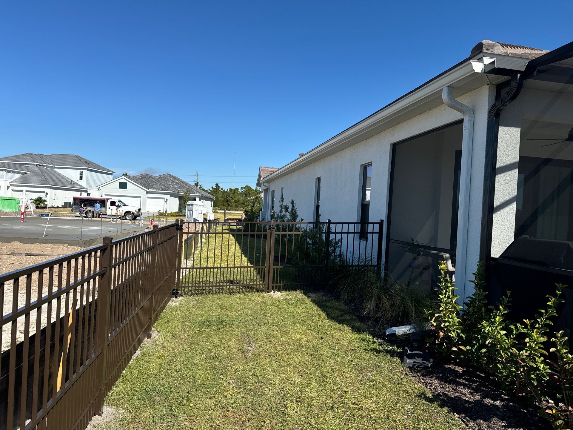 Aluminum Fence Installation using 4Ft 3 Rail Bronze Puppy Picket Aluminum Fence by Asap fence and gates, LLC