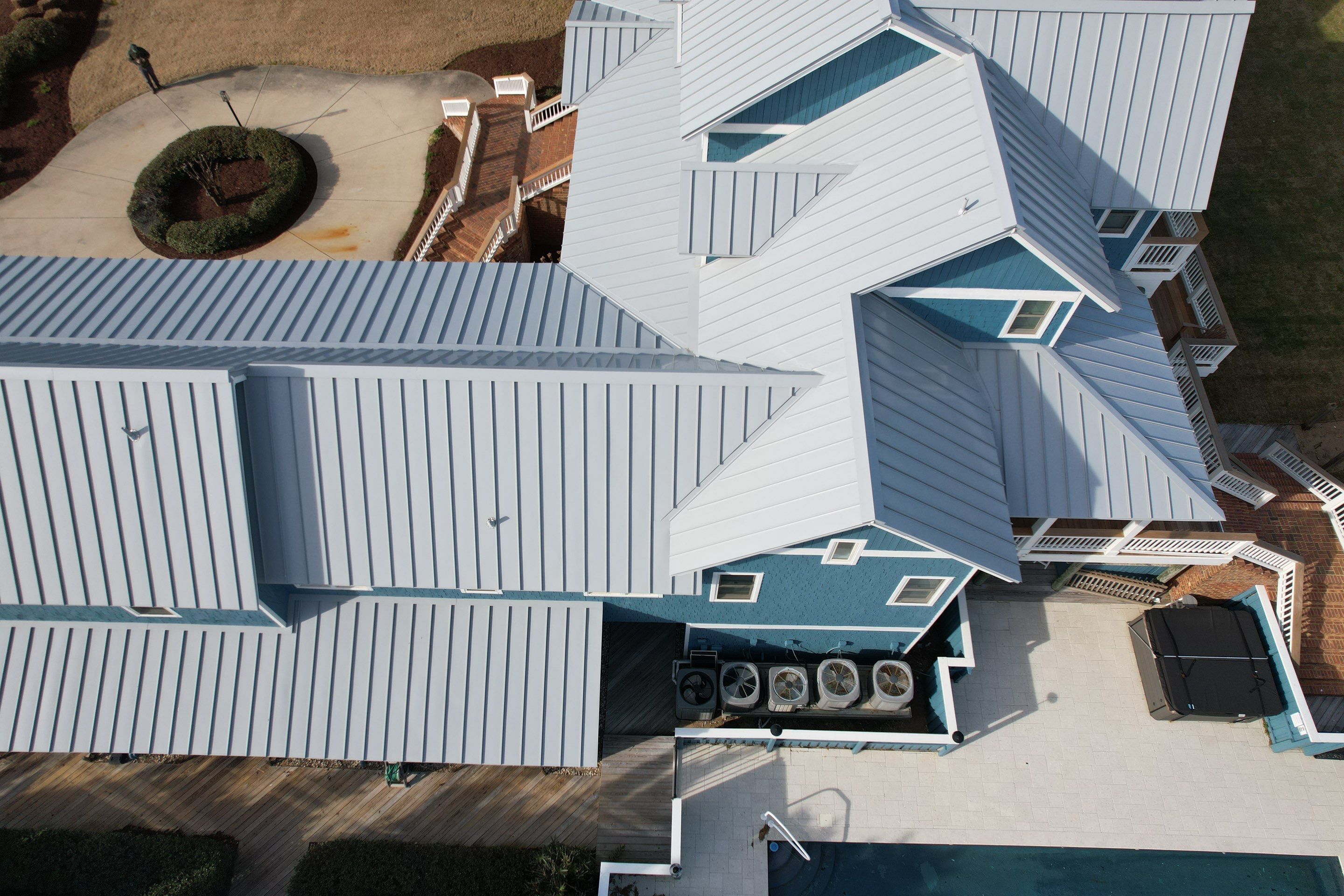 Large Metal Roof Transformation by Gallop Roofing & Remodeling, Inc.