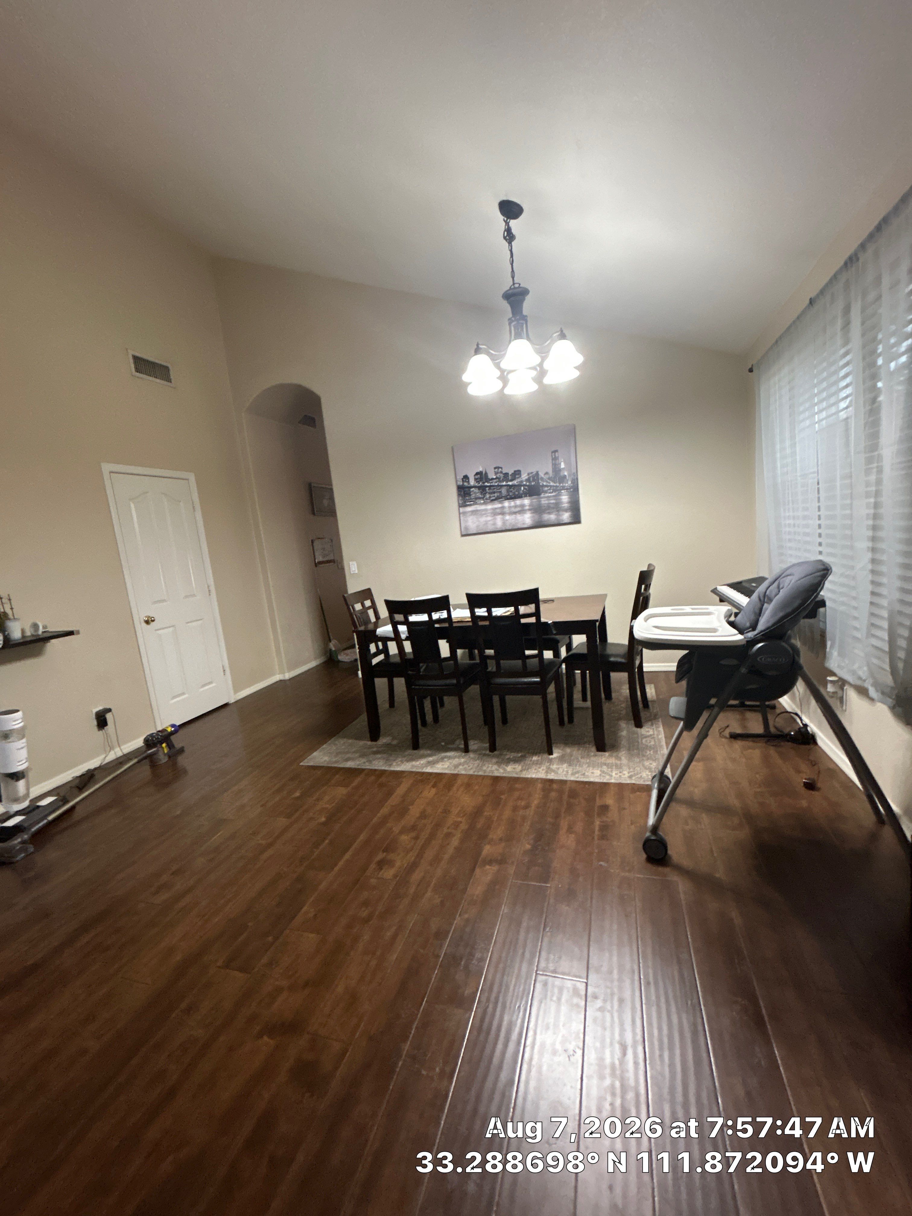 Modern Dining Room Renovation With Dark Wood Floors and Lighting by CompanyCam Sales Demo