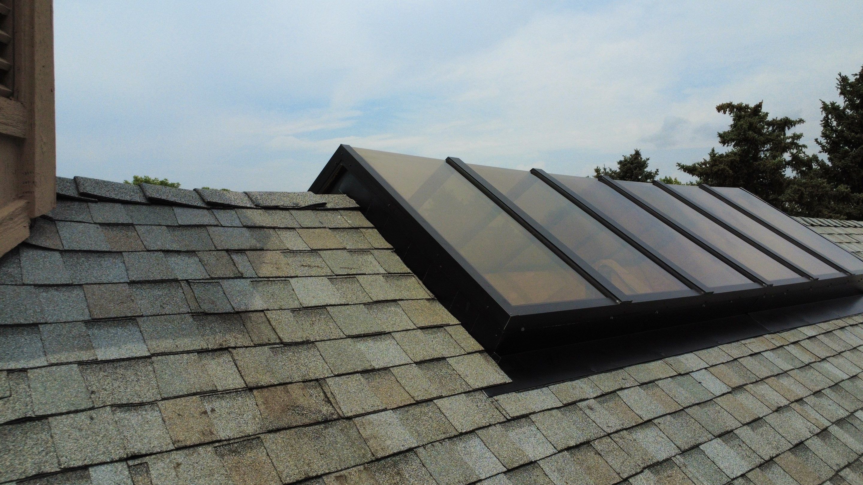 Asphalt Shingle and Skylight Replacement Project in Denver, CO by Blue Peaks Roofing LLC 
