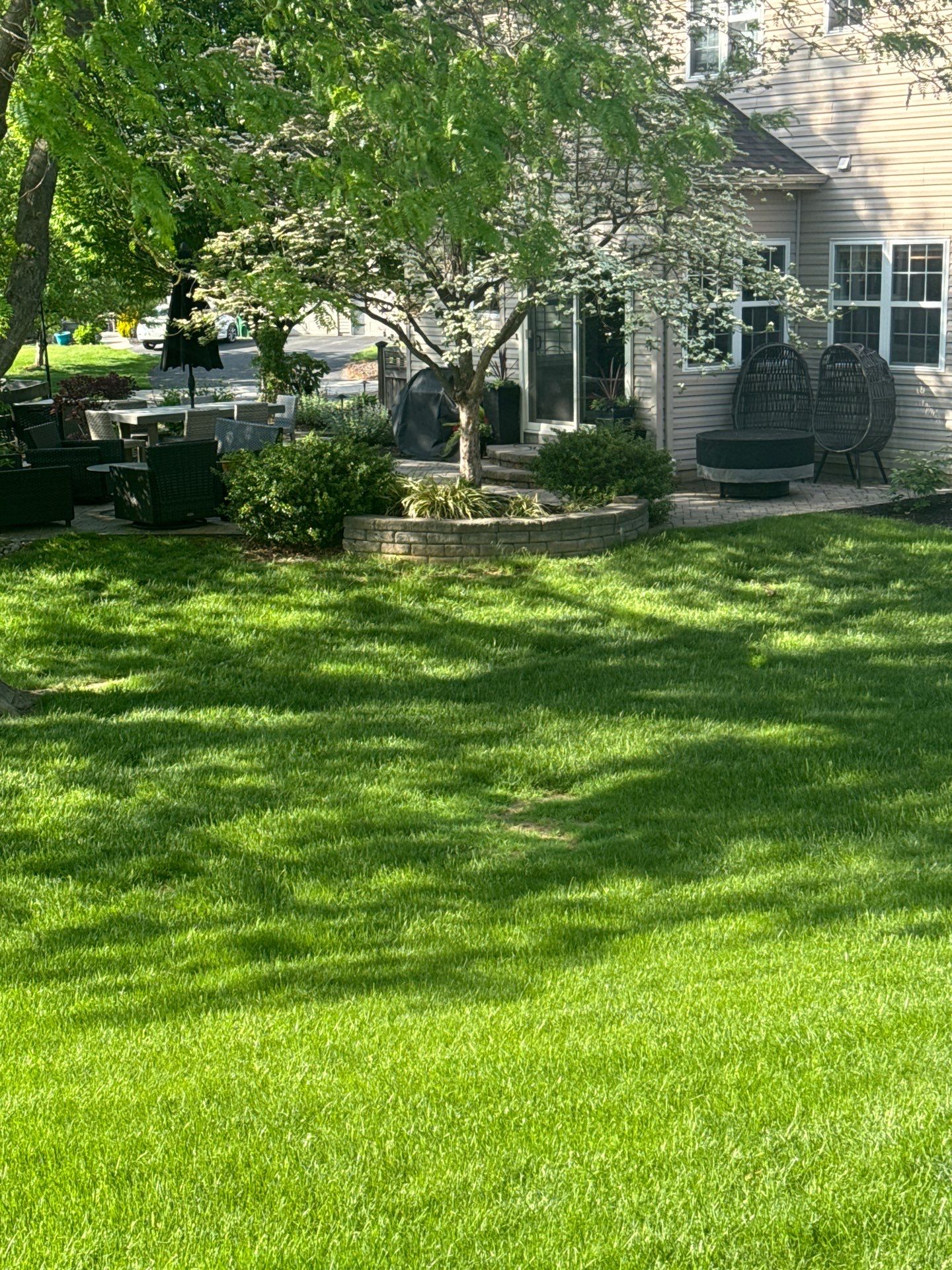 Backyard Retreat: Techo-Bloc Patio + Firepit Lounge by Saylor’s Lawn & Landscape