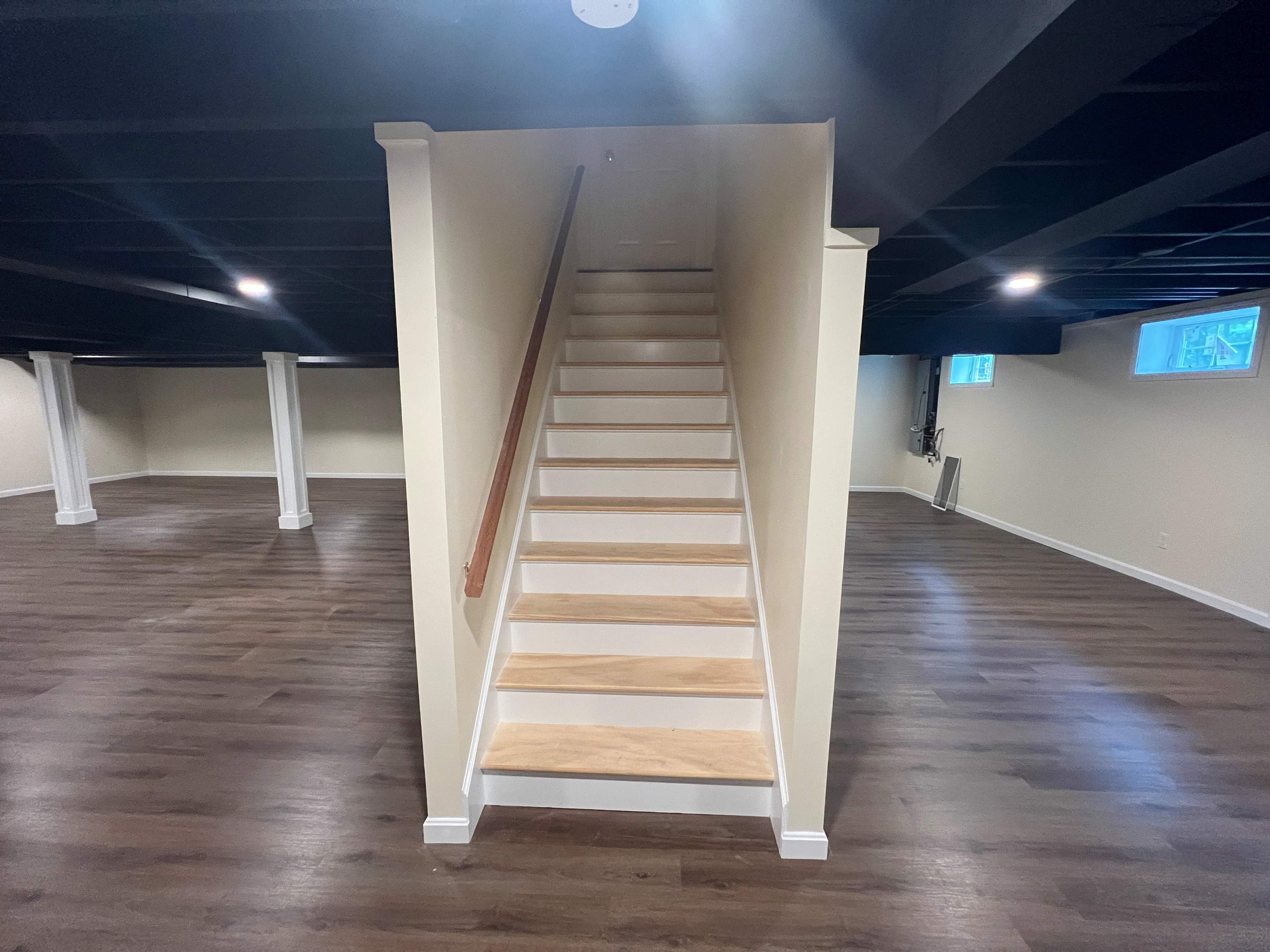Basement Remodel w/ LVP Flooring & Exposed Ceiling by Chagnon Building & Remodeling LLC