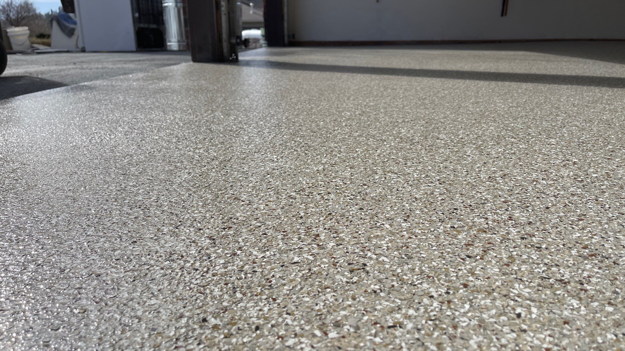 Garage Floor Polyaspartic Coating with Pebble Beach 1/4" Flakes by Croc Coatings, LLC