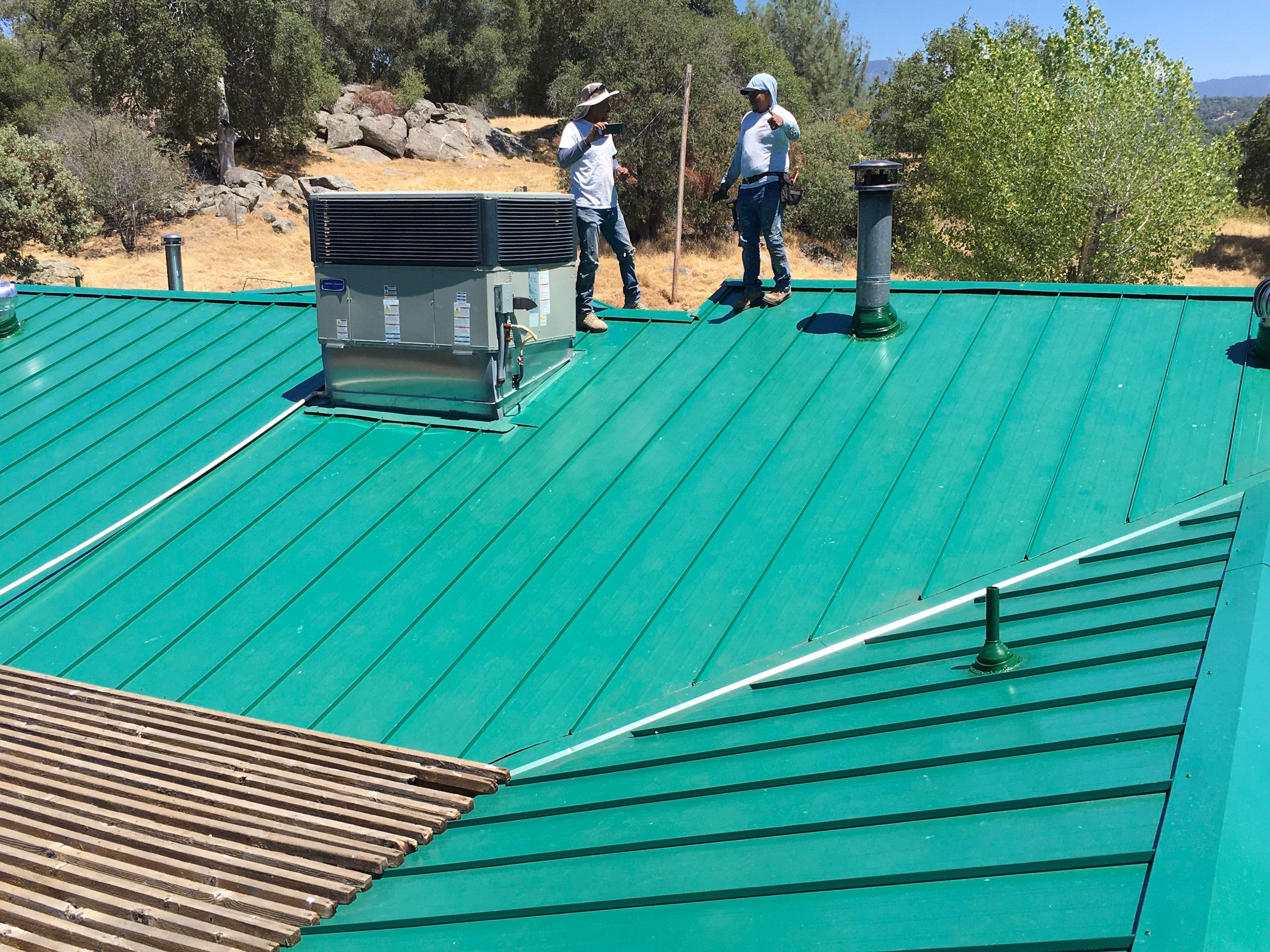Metal roofing installation using Standing seam metal roofing system by Straight Edge Roofing Inc