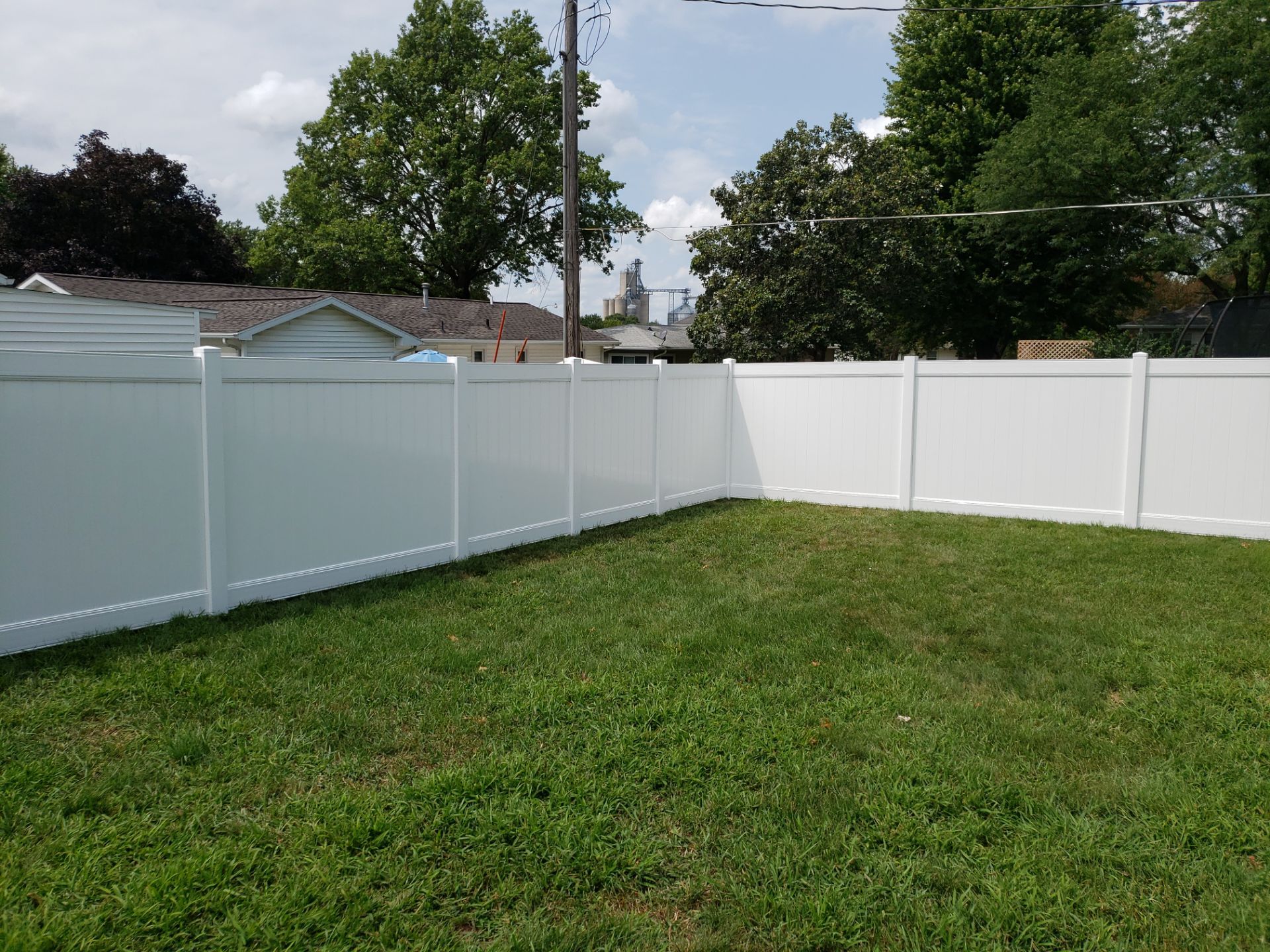 White Vinyl Privacy Fence Installation in Grundy Center by Perfect Picket Fence and Stain