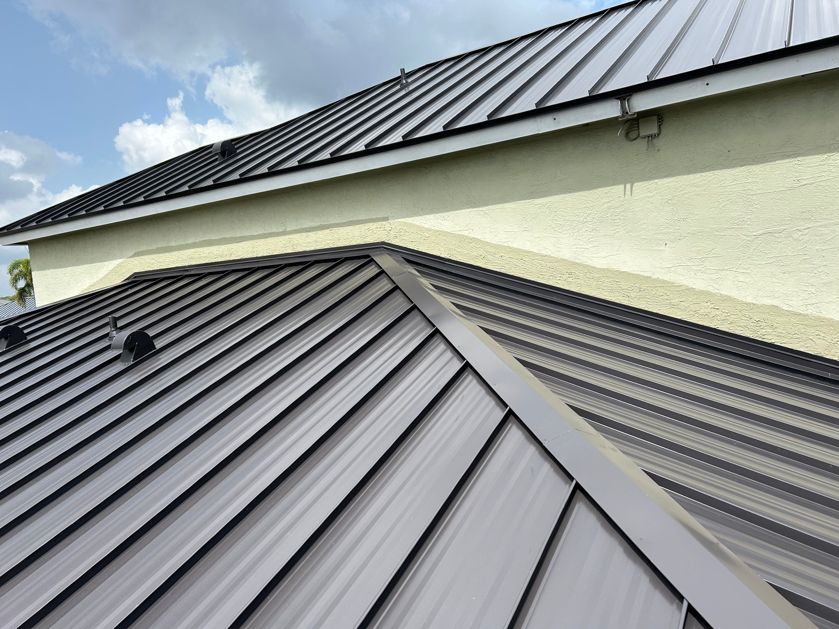24ga 1.5" Mechanical Seam Dark Bronze by Total Roofing System The Metal Roof Experts