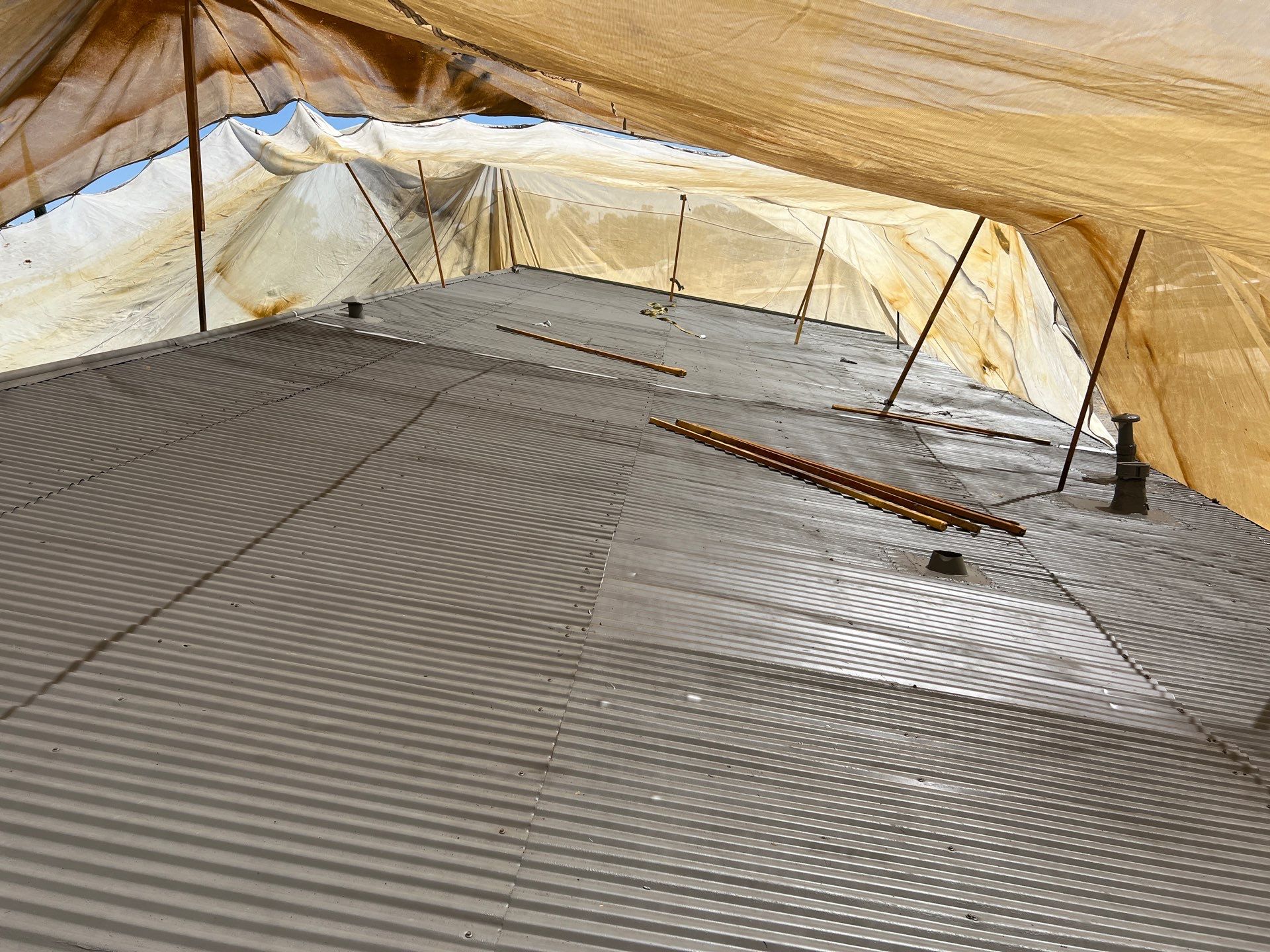 Spray foam and coatings using Conklin Benchmark/ PUMA XL acrylic coatings over metal and foam by Straight Edge Roofing Inc