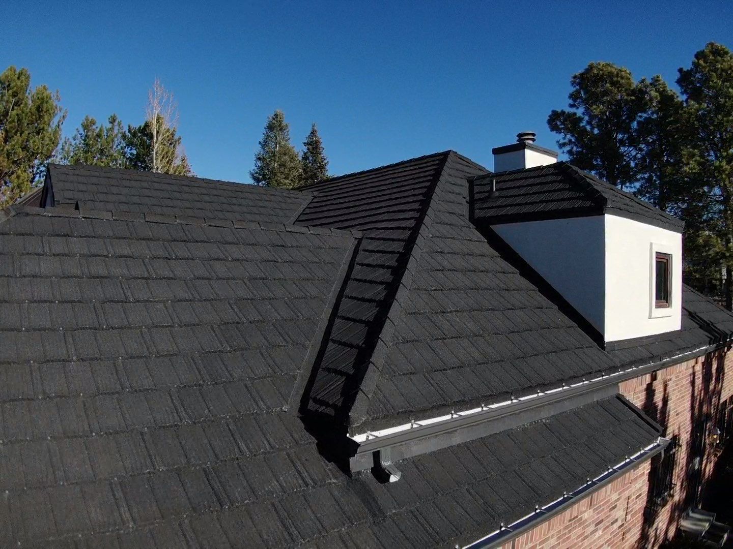 Unified Stone Coated Roof & Stucco Remodle by Blue Peaks Roofing LLC