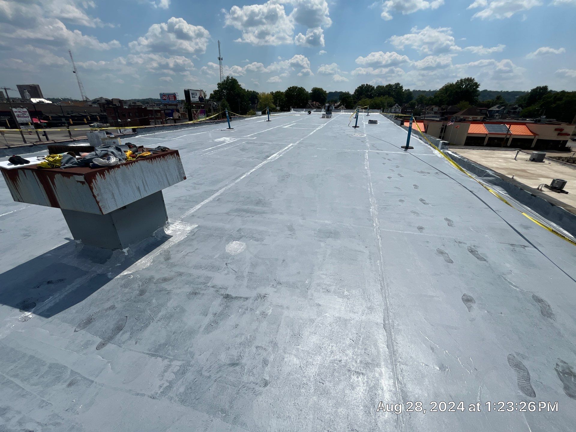 Commercial Roofing Installation using smartcoat Roof coating by Fahey Roofing + Contracting