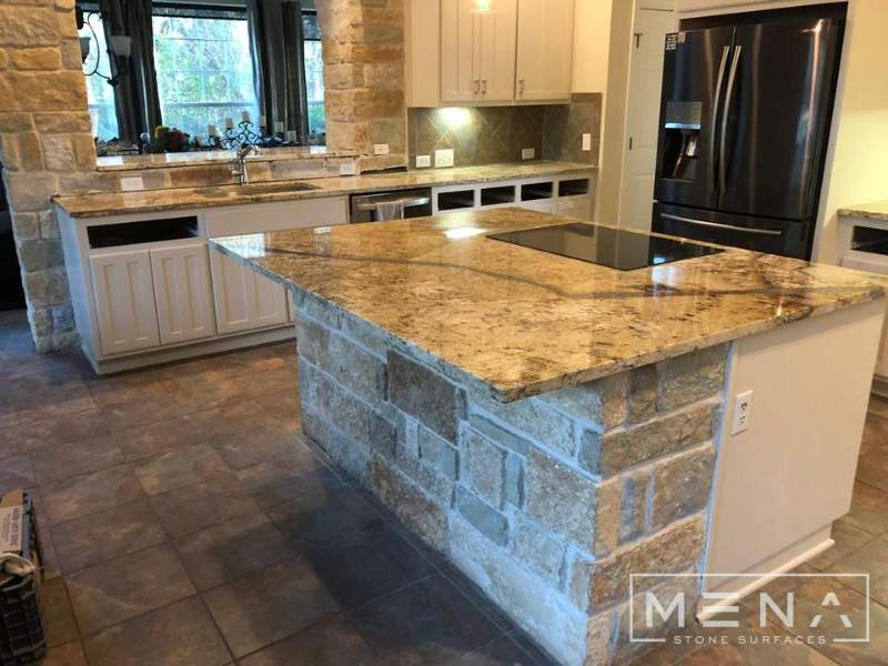 Kitchen countertops using Yellow River Granite  by Mena stone surfaces