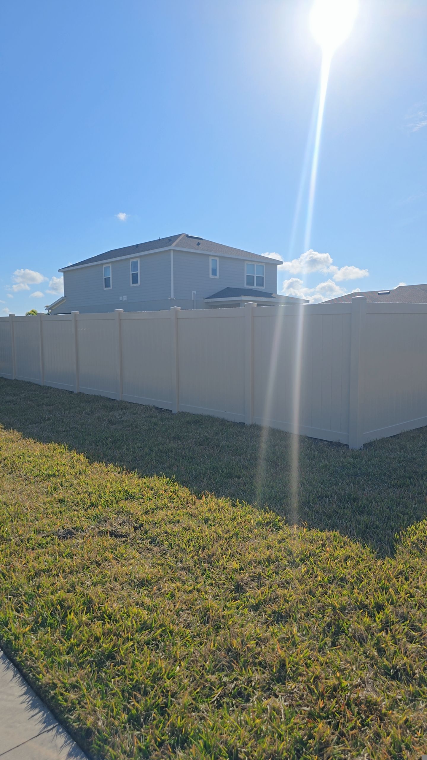 Tan Vinyl Fence in West Port by True Fence LLC