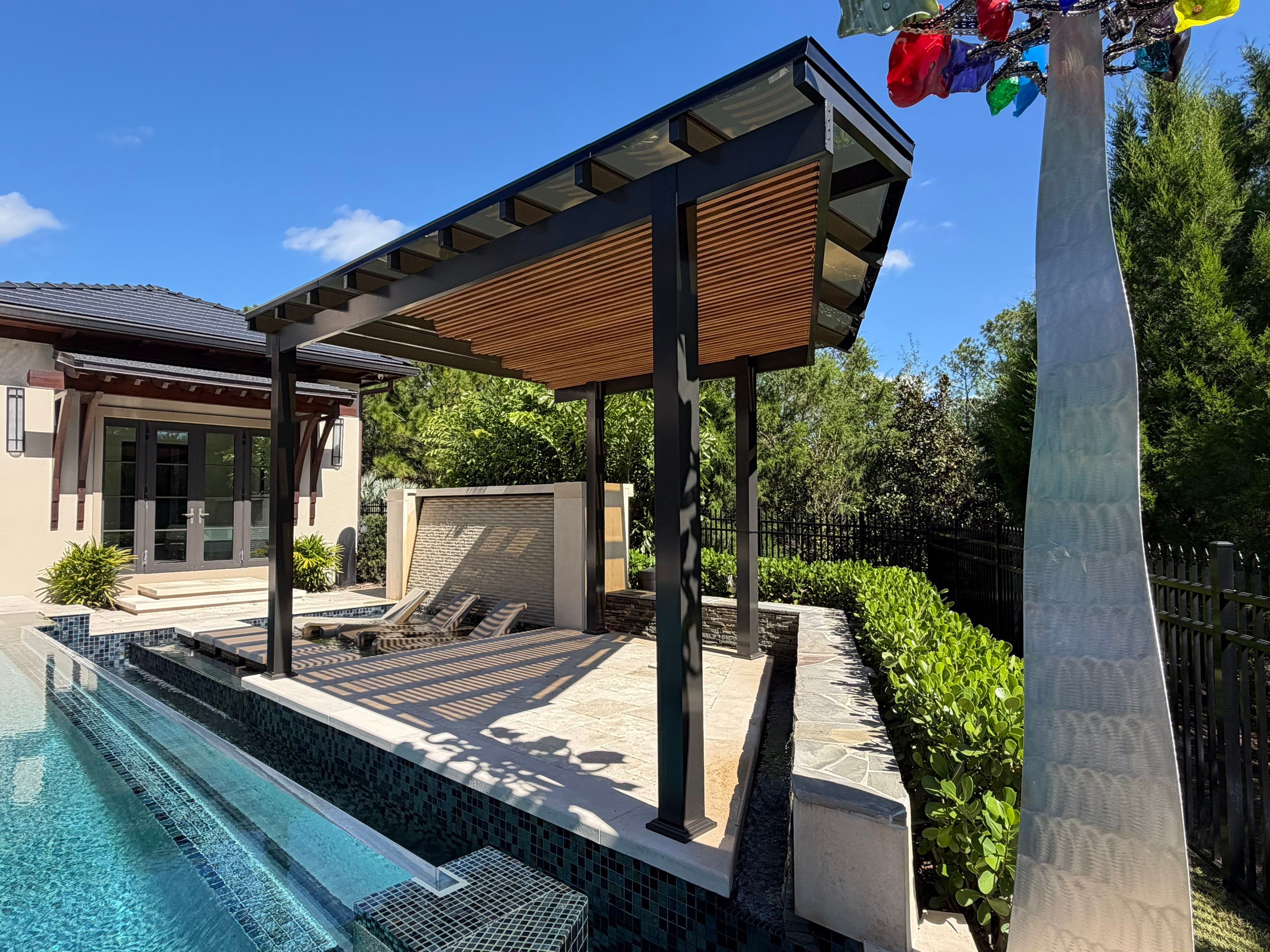 Sculpting with Light: Translucent Roof System with Garapa Accents by Orlando pergolas 