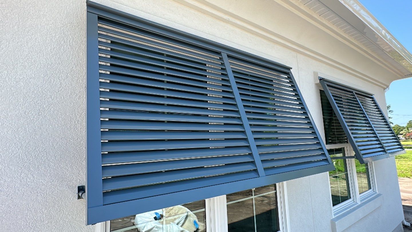 Bahama Shutters in Blue Grey  by Smart Guard Shutters