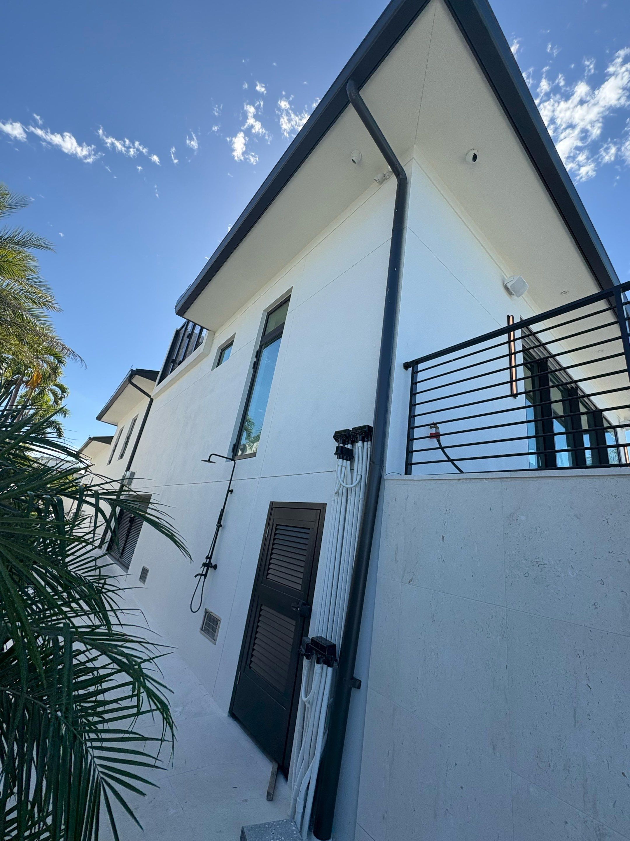 Seamless Aluminum Gutter Installation using black seamless gutters in Sarasota FL by Gutter Professors