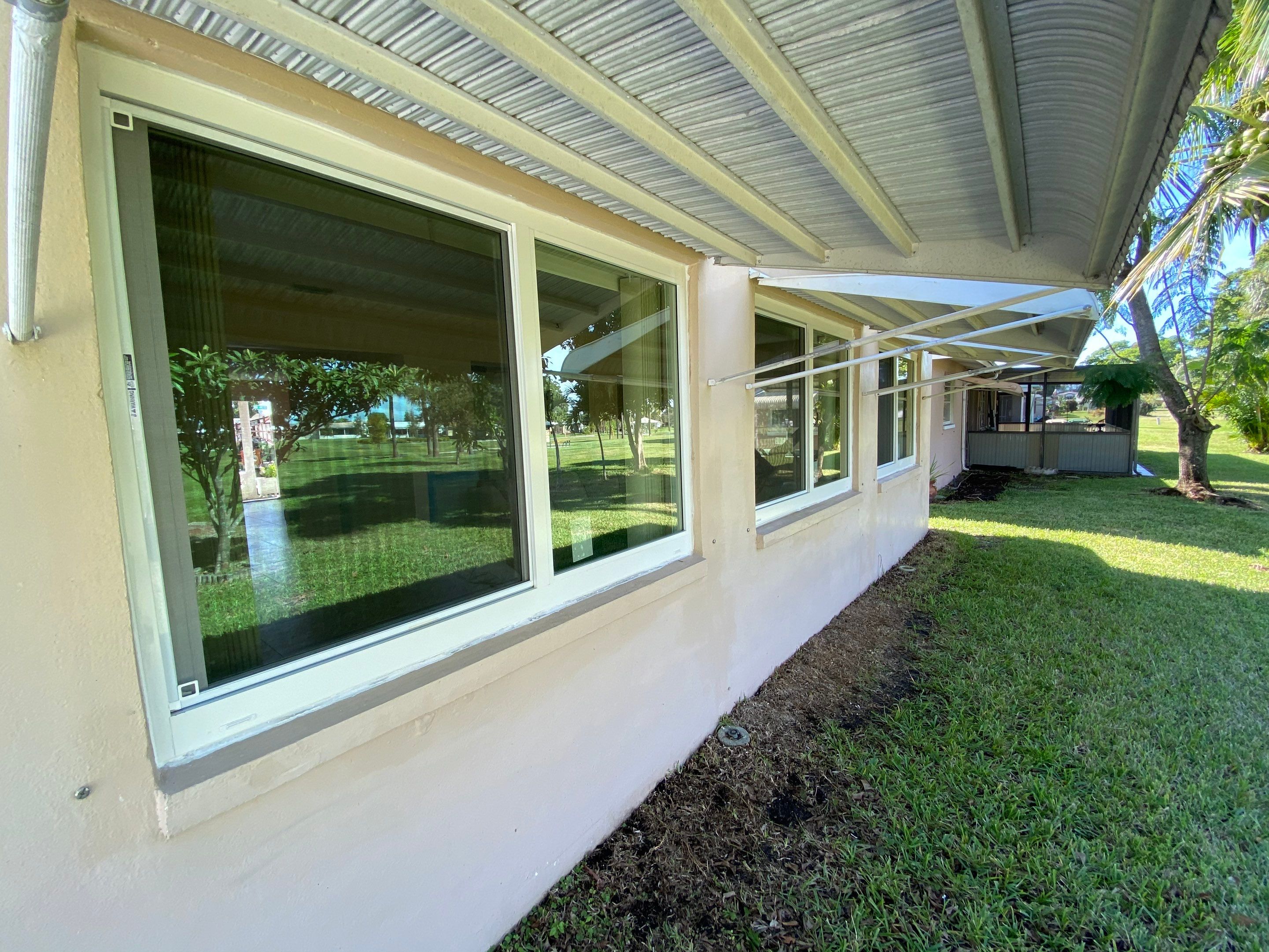 Tamarac Residential Entry Door and Aluminum Window Installation Project by The Door Doctor of South Florida, Inc.