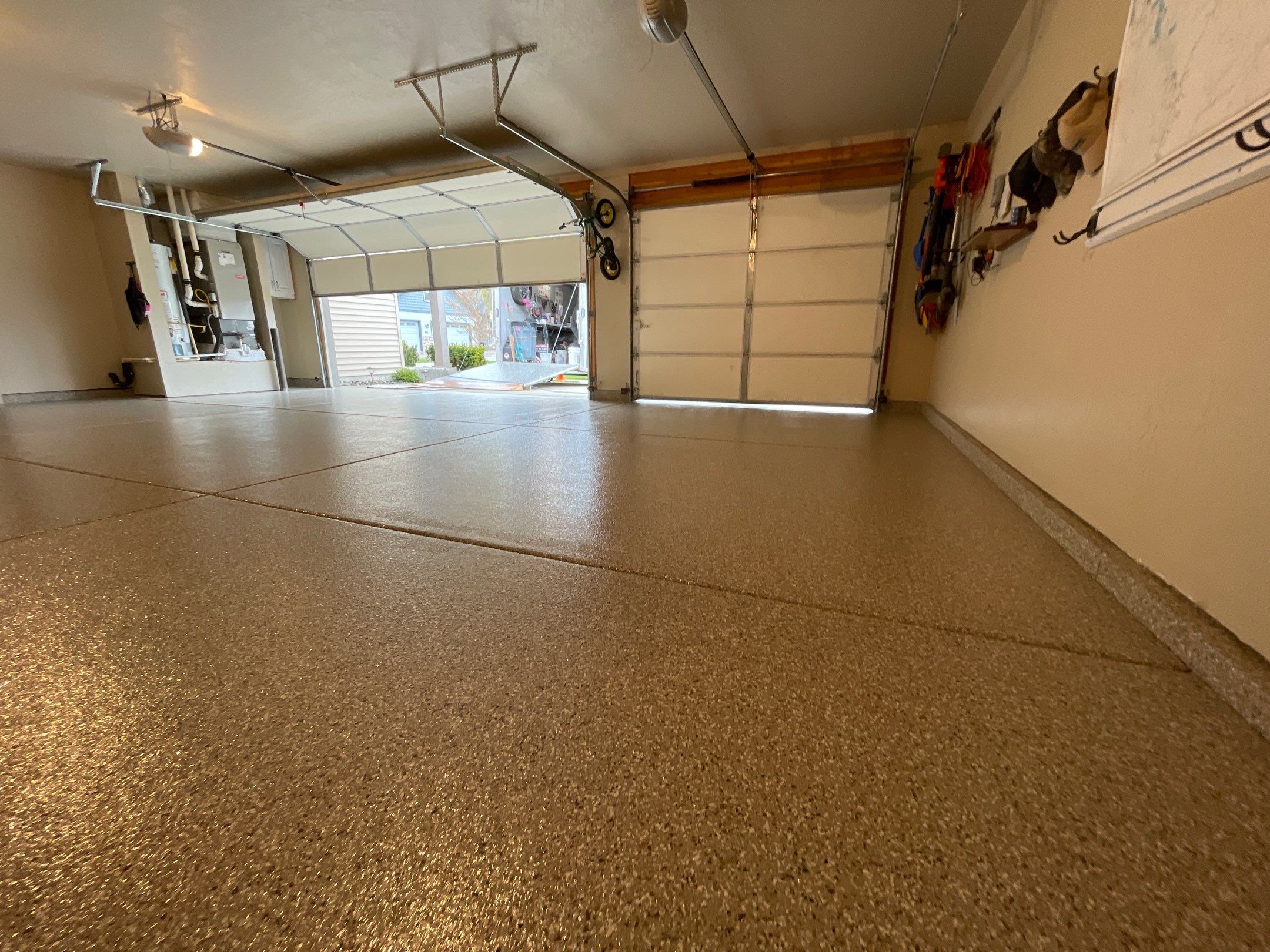 Garage Transformation using Pebble Beach and Front Porch using Greystone by Croc Coatings, LLC