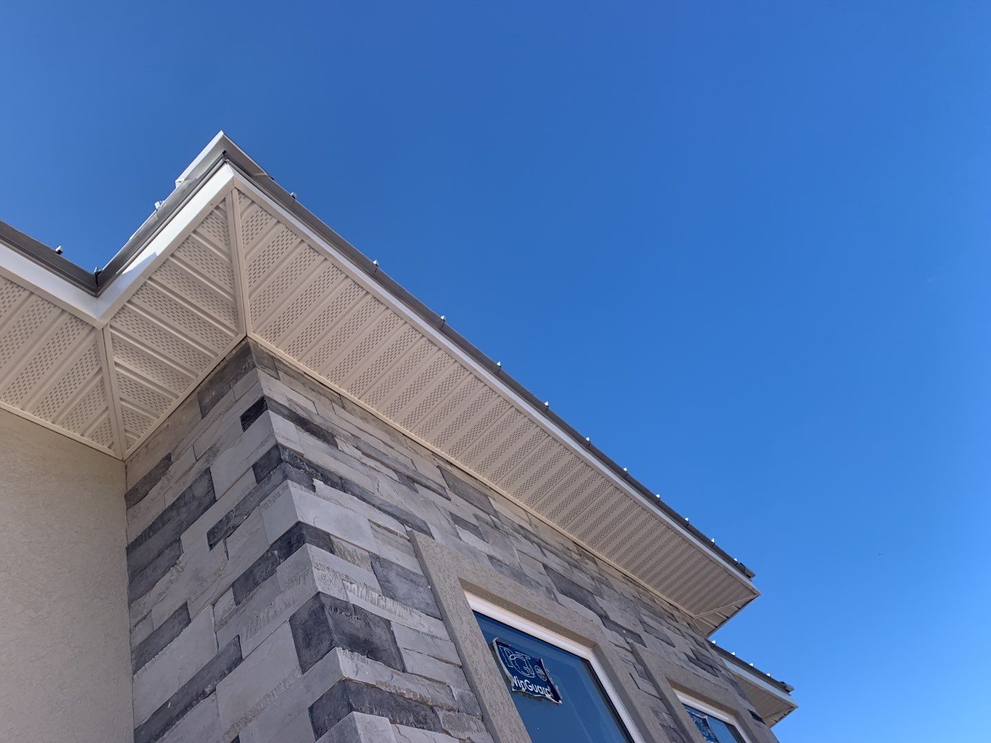 Soffit and Fascia Installation using White Vinyl Soffit in Pensacola FL by Gutter Professors