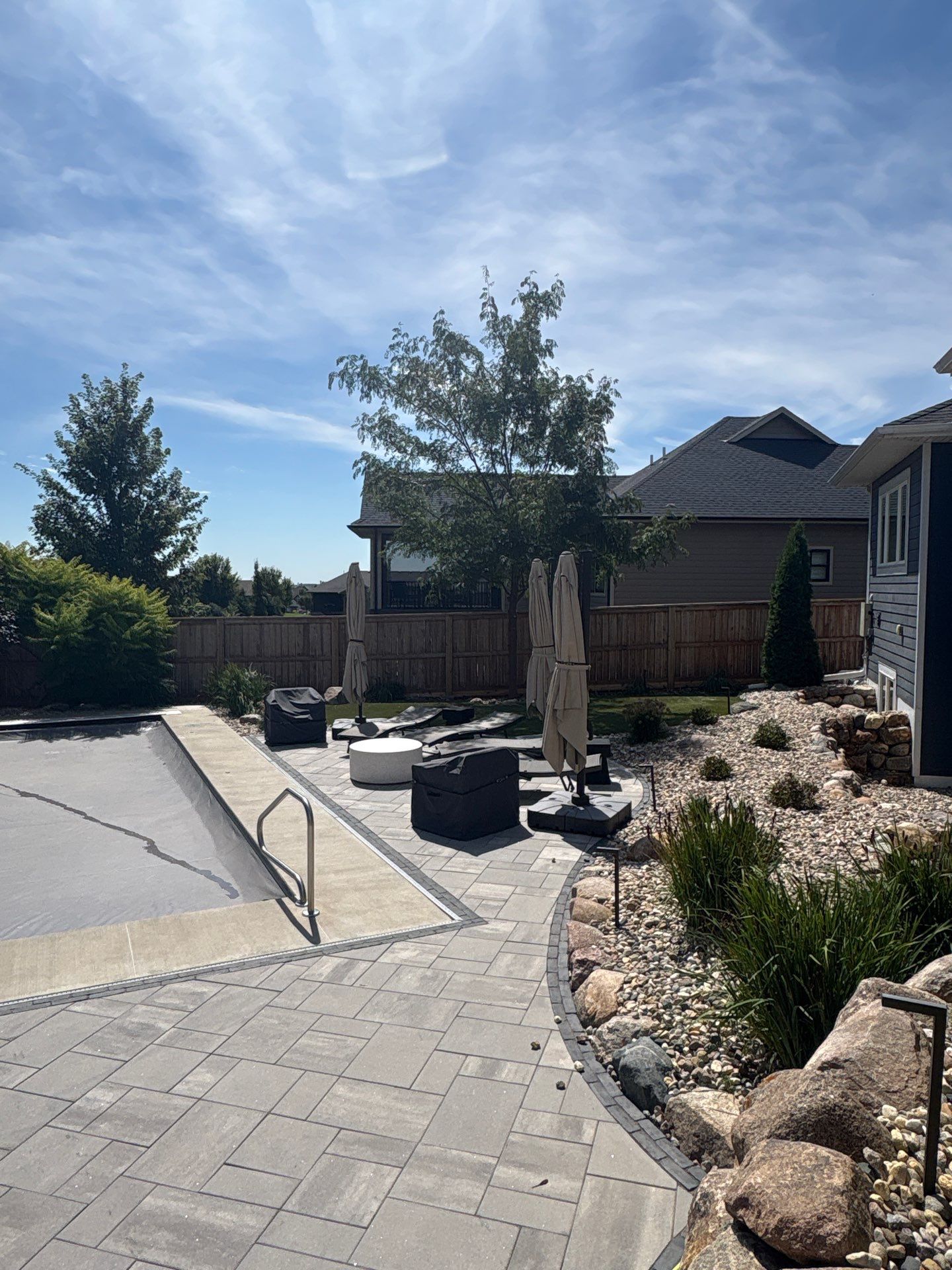 Custom Privacy Fence and Paver Patio Installation in Sioux Falls by Select Painting, Coatings & Garage Cabinets