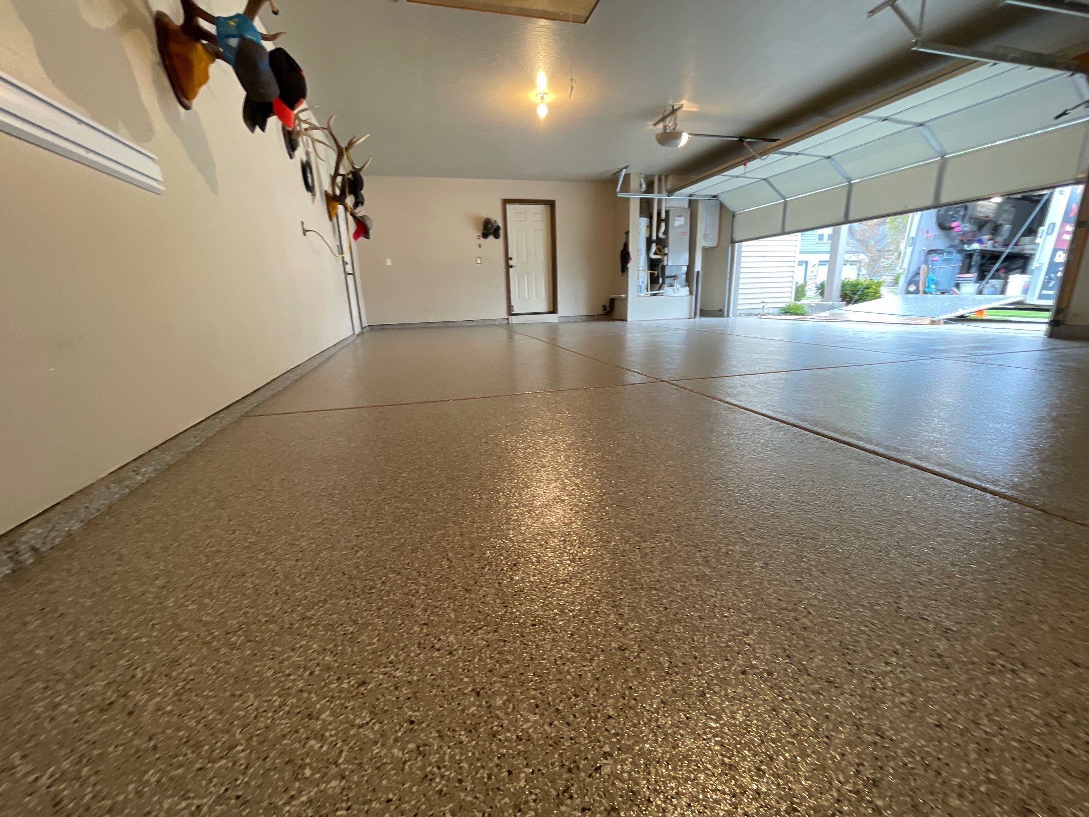 Garage Transformation using Pebble Beach and Front Porch using Greystone by Croc Coatings, LLC
