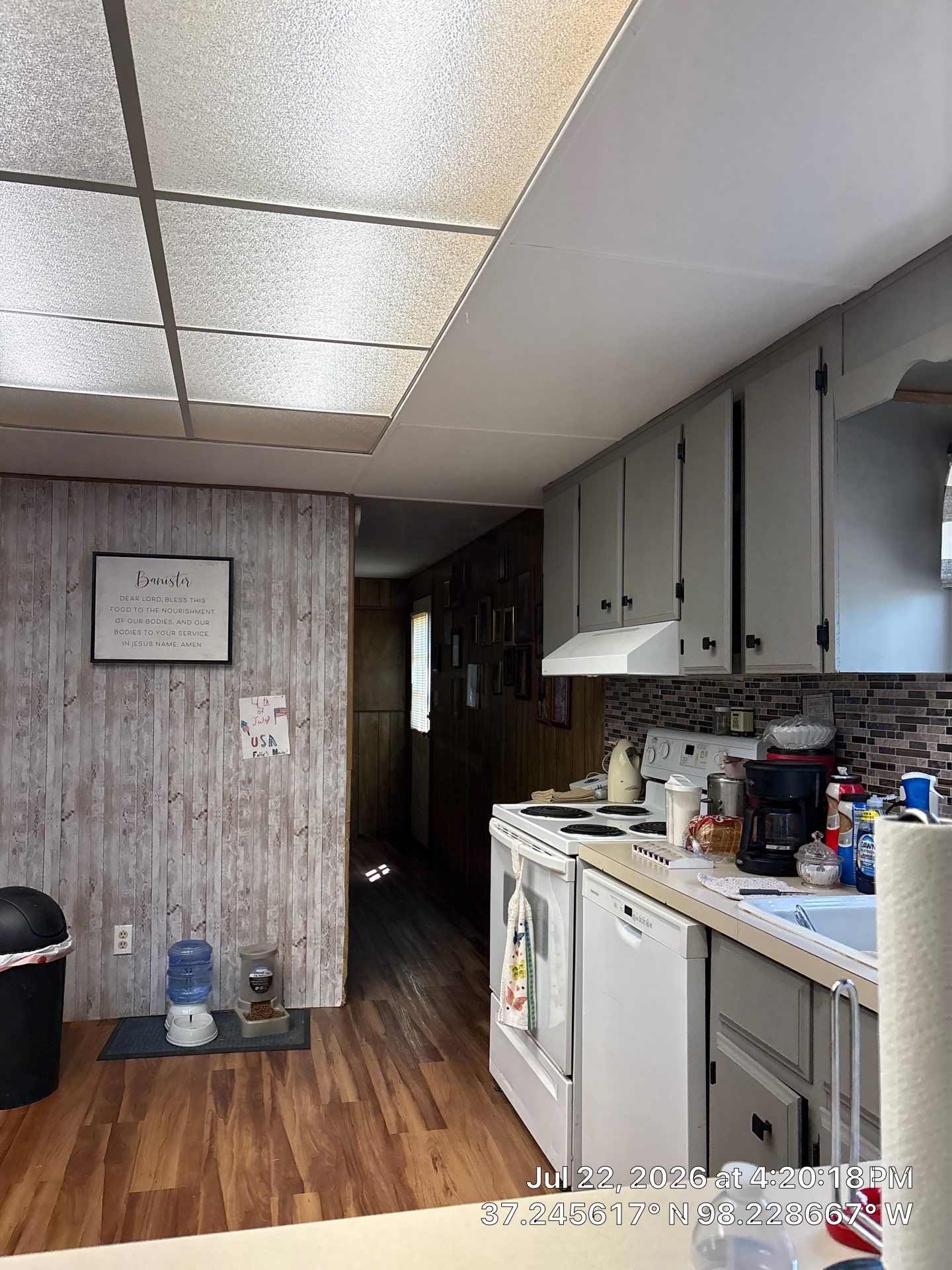 Kitchen Renovation Featuring Grey Cabinetry and Laminate Flooring in Attica by CompanyCam Sales Demo