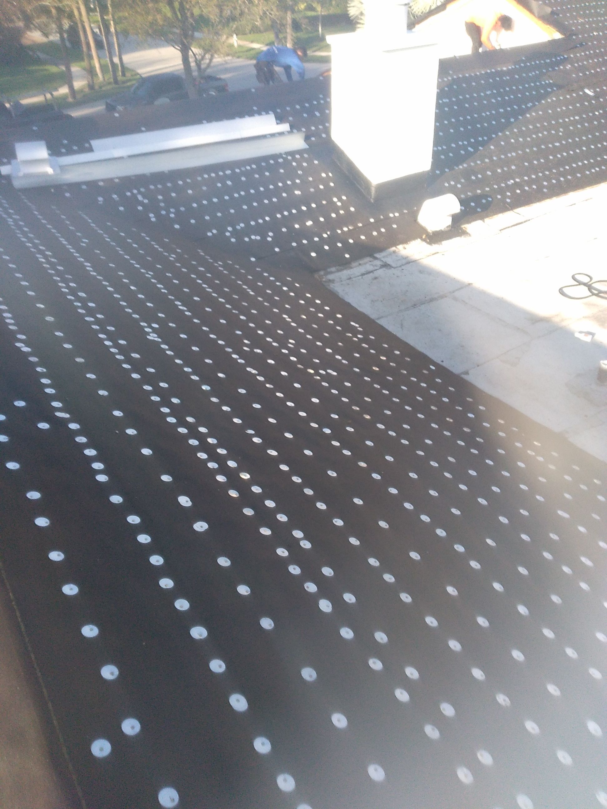 Residential Roofing Installation using 1" Nail strip metal roof by BLUES BROTHERS CONSTRUCTION CORP