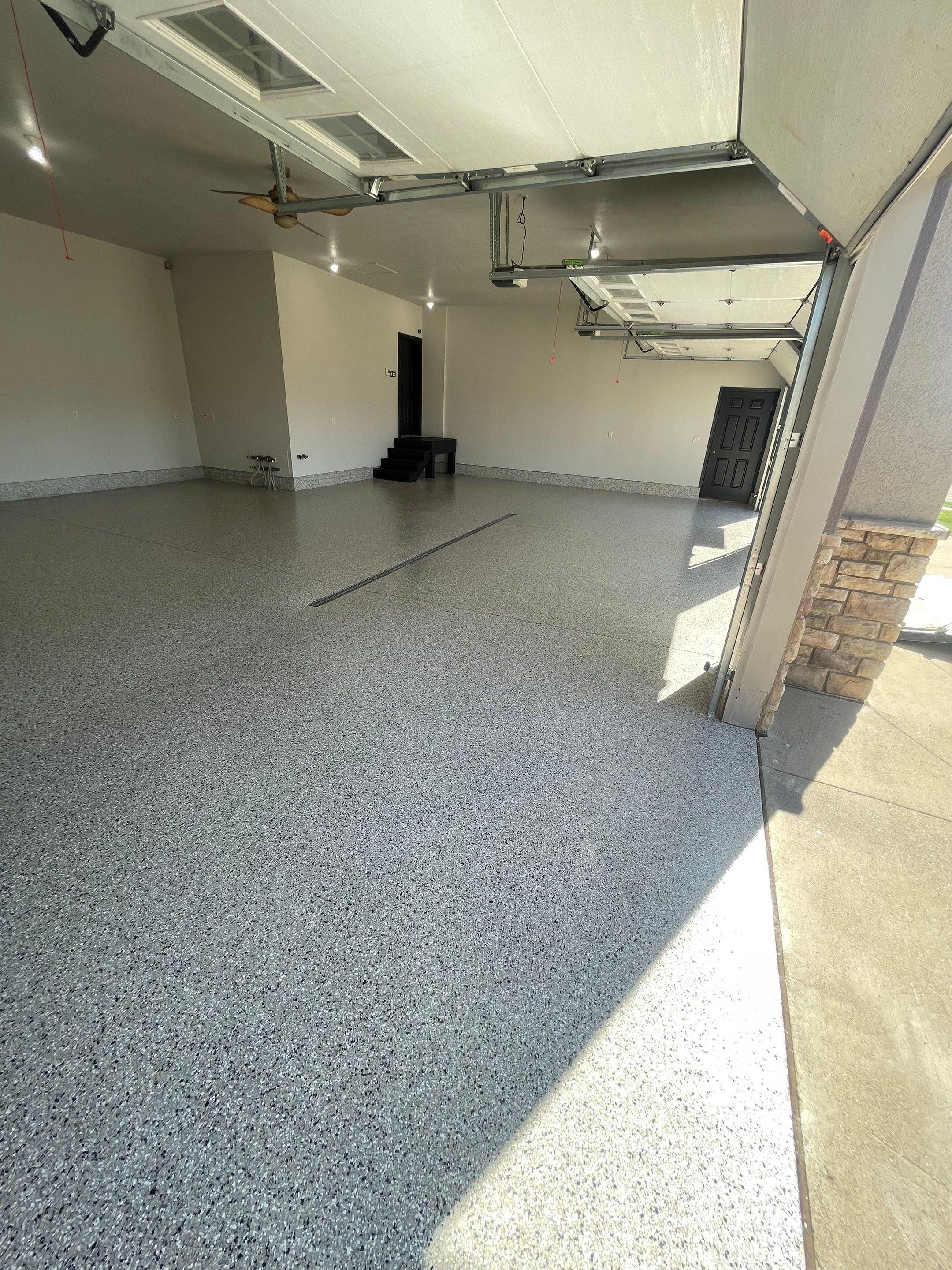 Multi-Car Garage Epoxy Floor Coating in Beresford by Select Painting, Coatings & Garage Cabinets