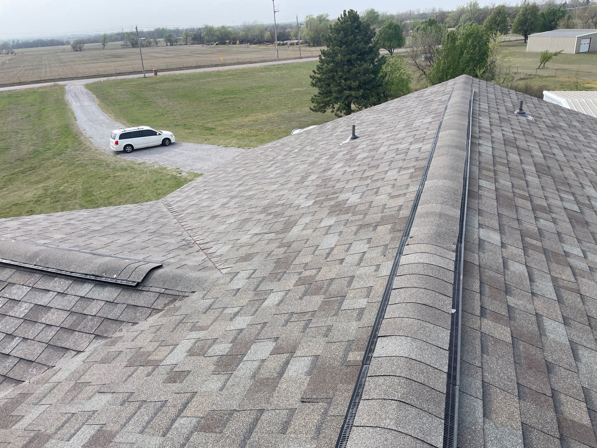 Roof Siding & Window Project in Mustang, OK by Z Construction & Roofing, LLC