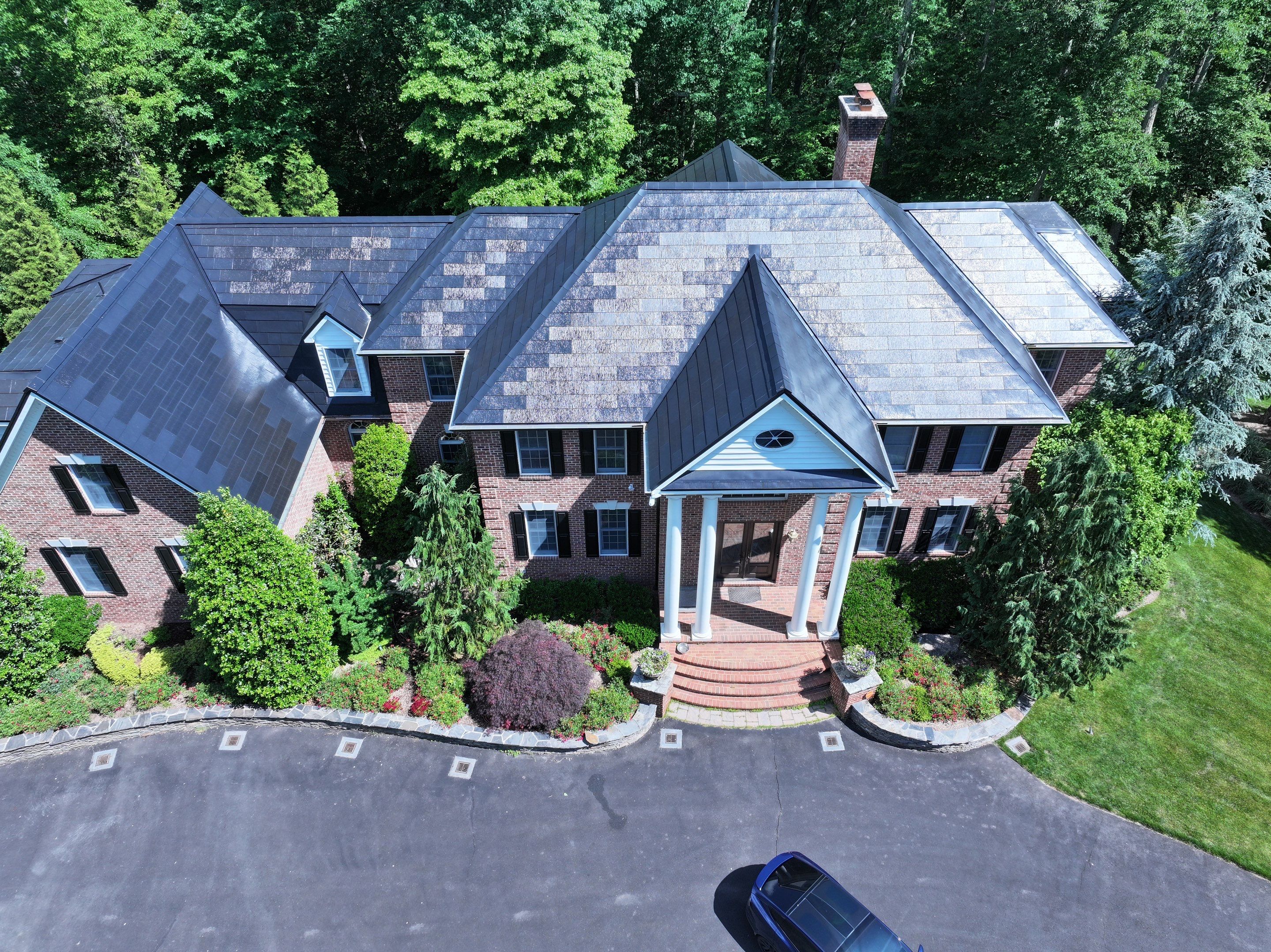 Tesla Solar Roof Replacement by American Home Contractors