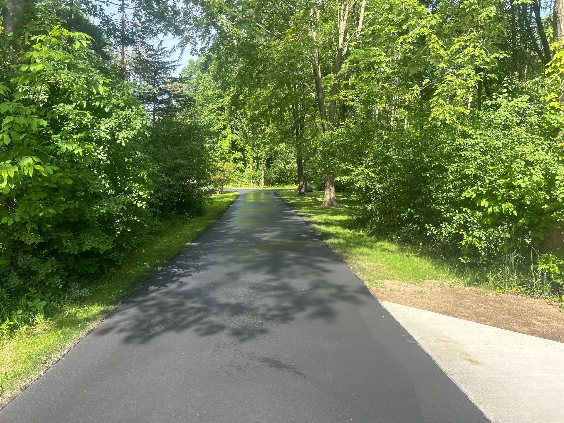 High end residential driveway by Quality Asphalt & Maintenance LLC