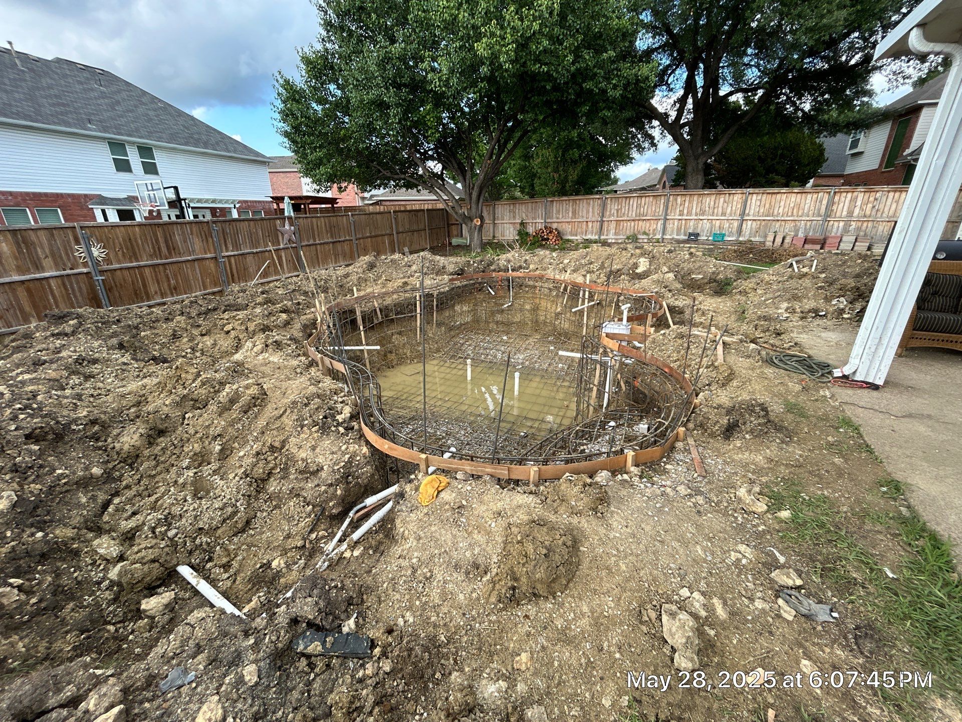 Compact Freeform Spool with Dark Coping by Pinnacle Pools and Spas - DFW