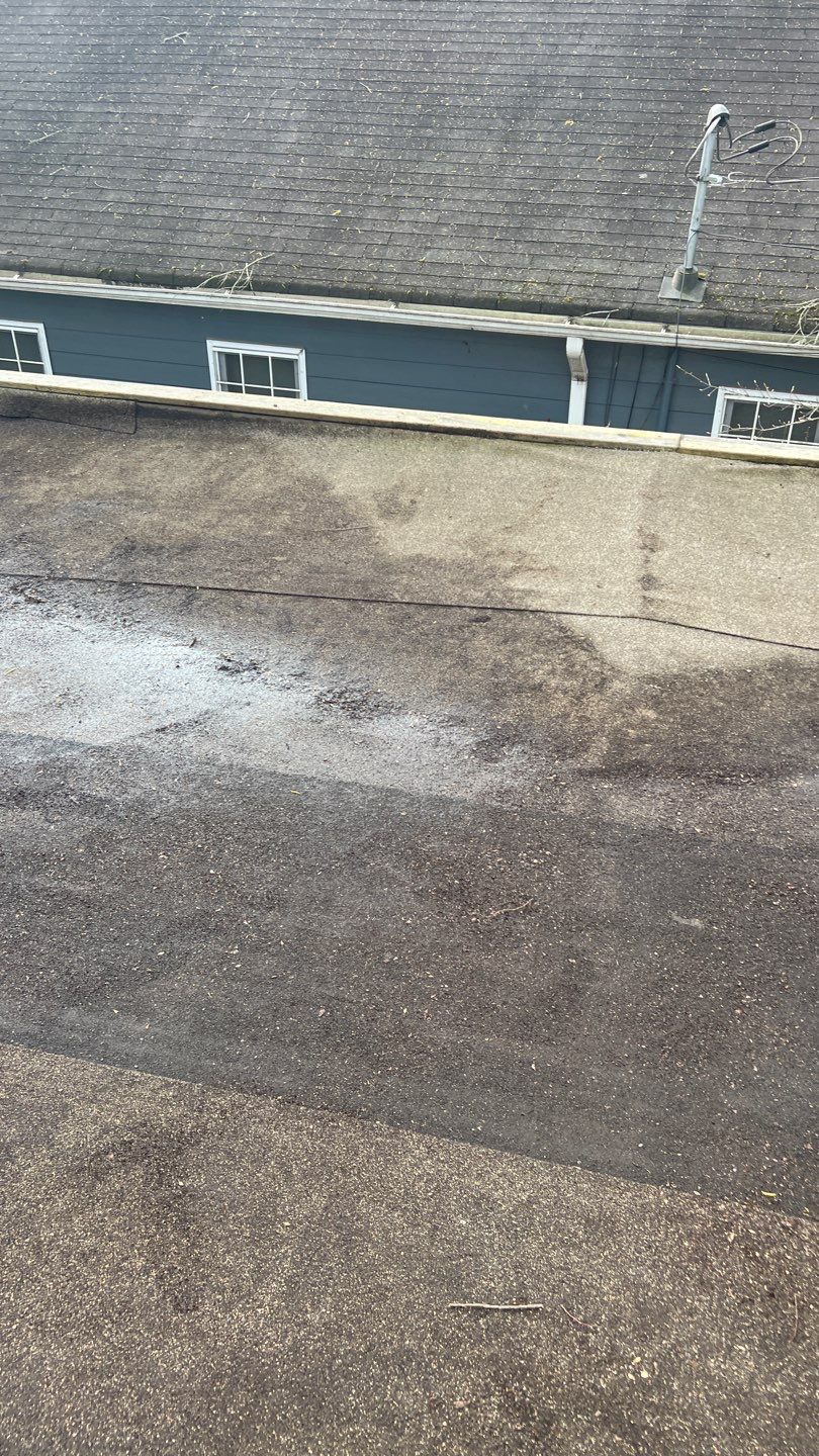 Gutter Cleaning using brown bags by Roof Bullies