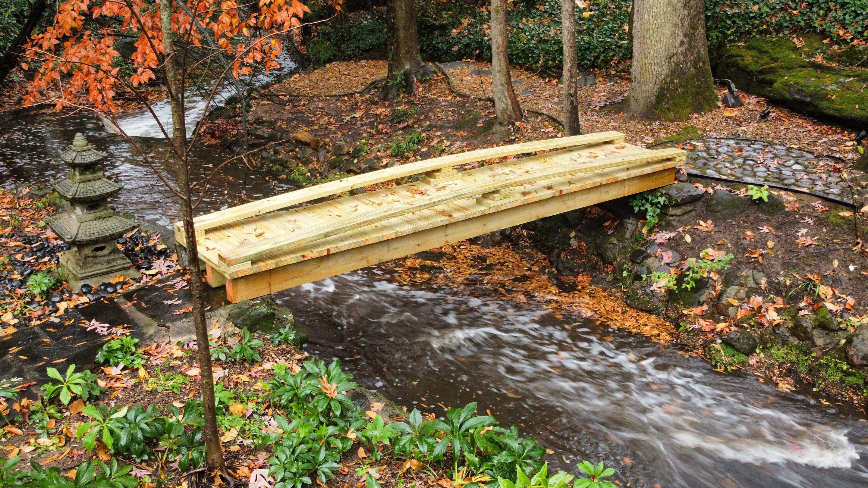 Pressure-Treated Wood Deck Replacement and Garden Bridge in Atlanta by Swift Home Renovations