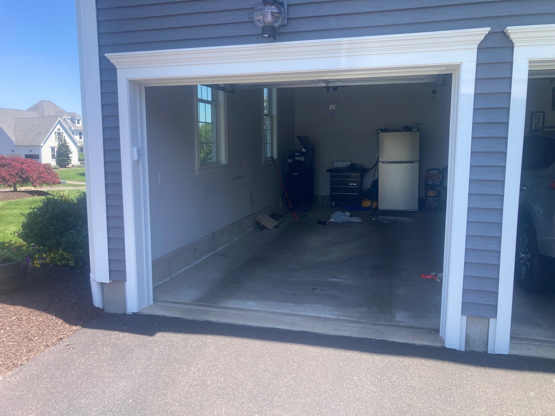 Concrete Floor Coating Transformation by DiGiorgi Roofing and Siding Inc