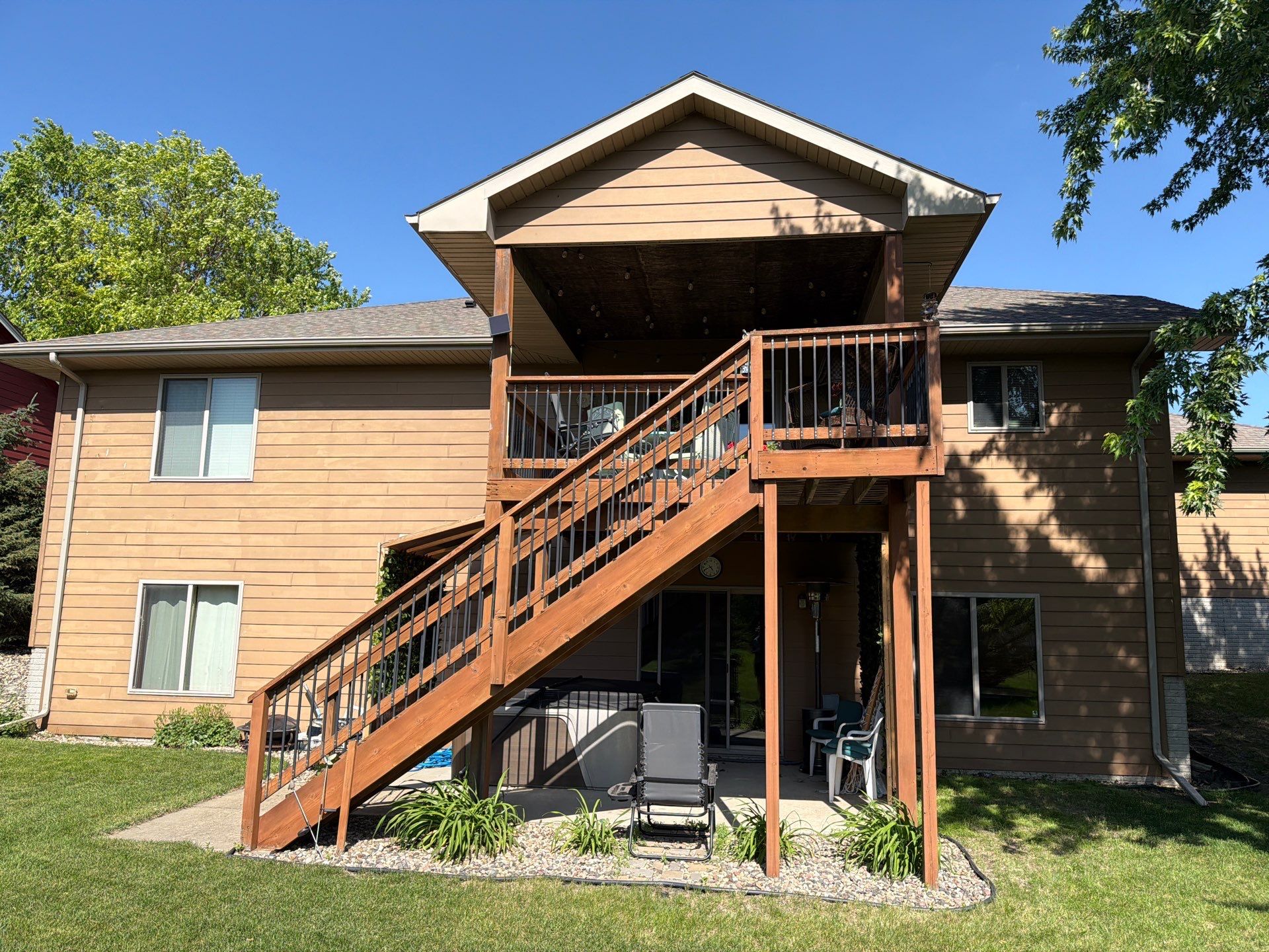 Full Exterior Residential Painting and Siding Refresh in Tea by Select Painting, Coatings & Garage Cabinets