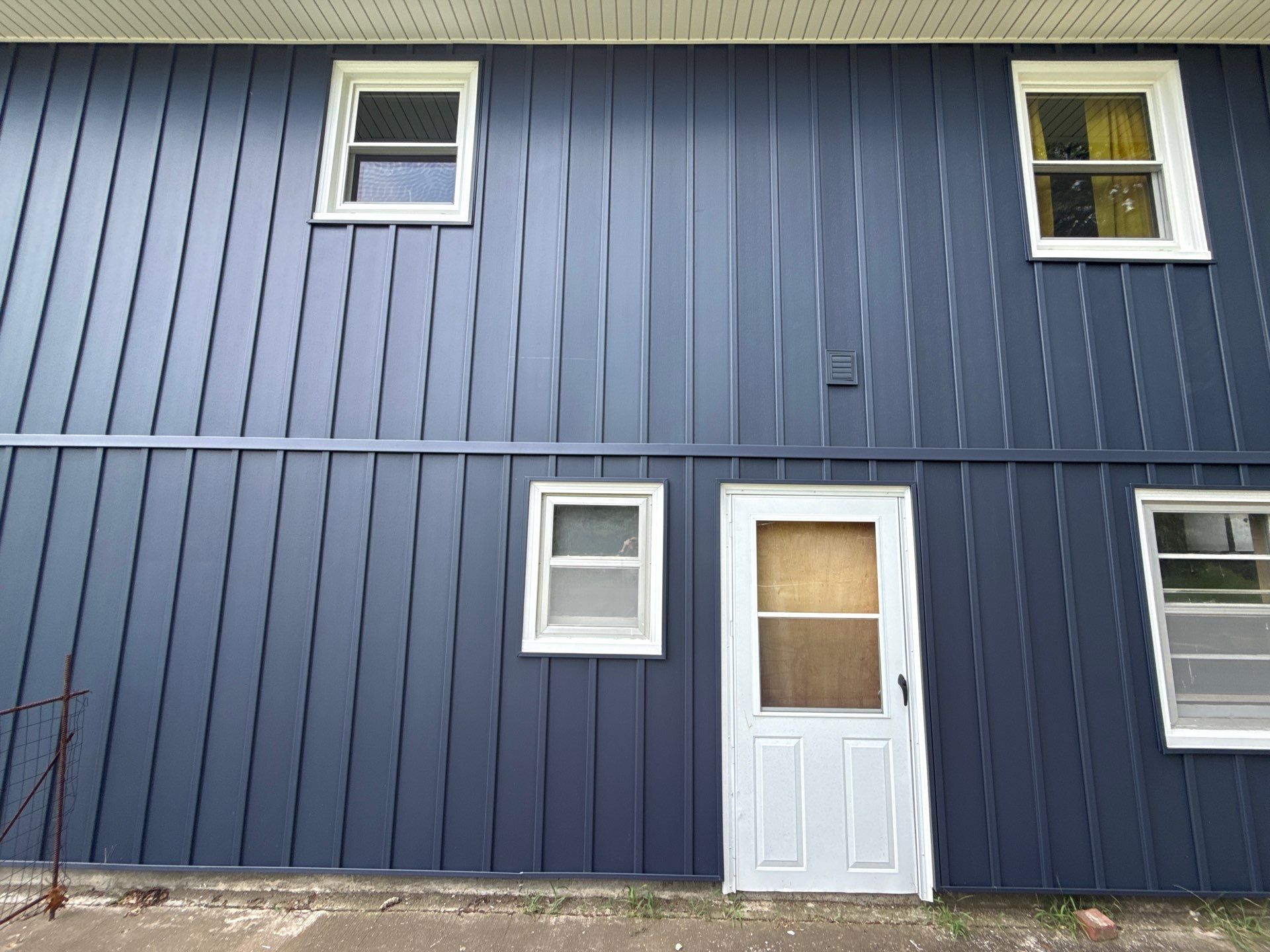 Indigo Board and Batten Siding and Window Replacement in Smithville by EEC Windows, Siding & Roofing